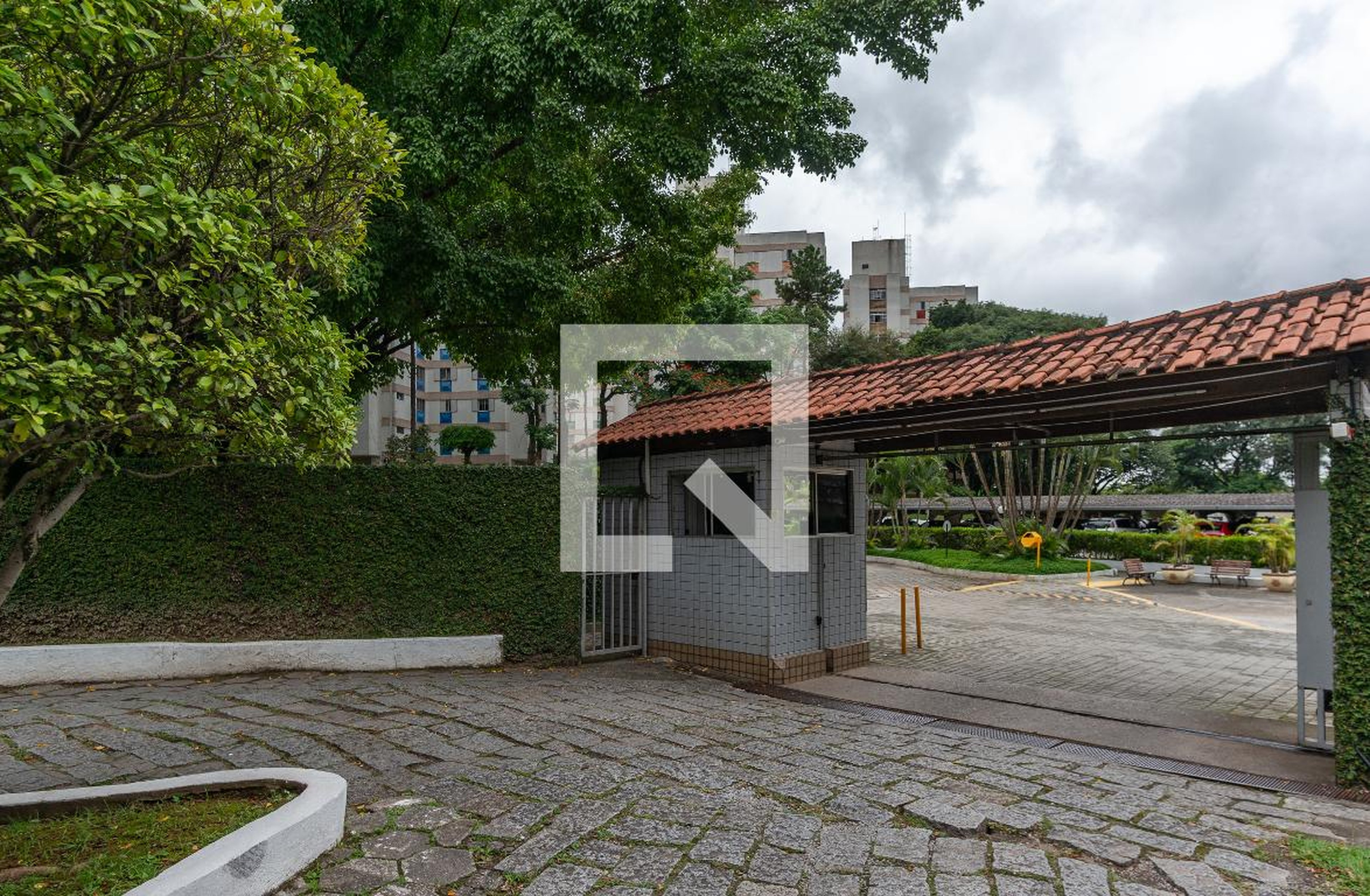 Fachada do Condomínio Condomínio Village