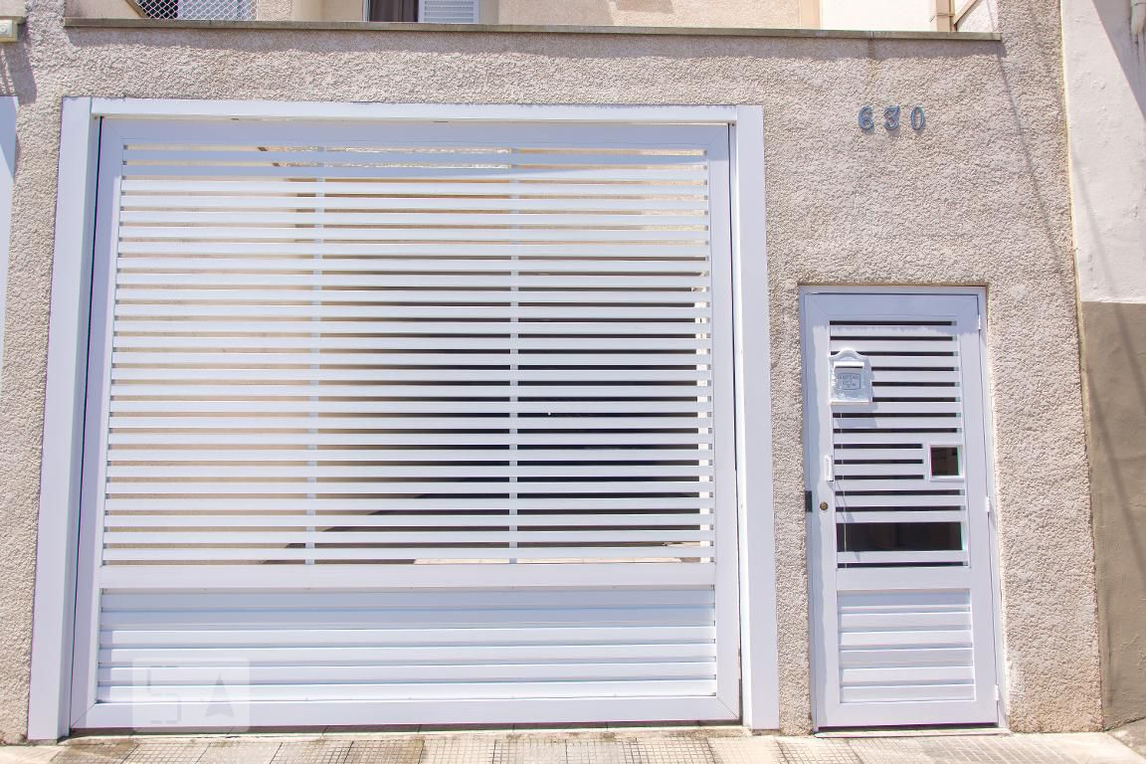 Fachada Condomínio em Rua Arujá, 630