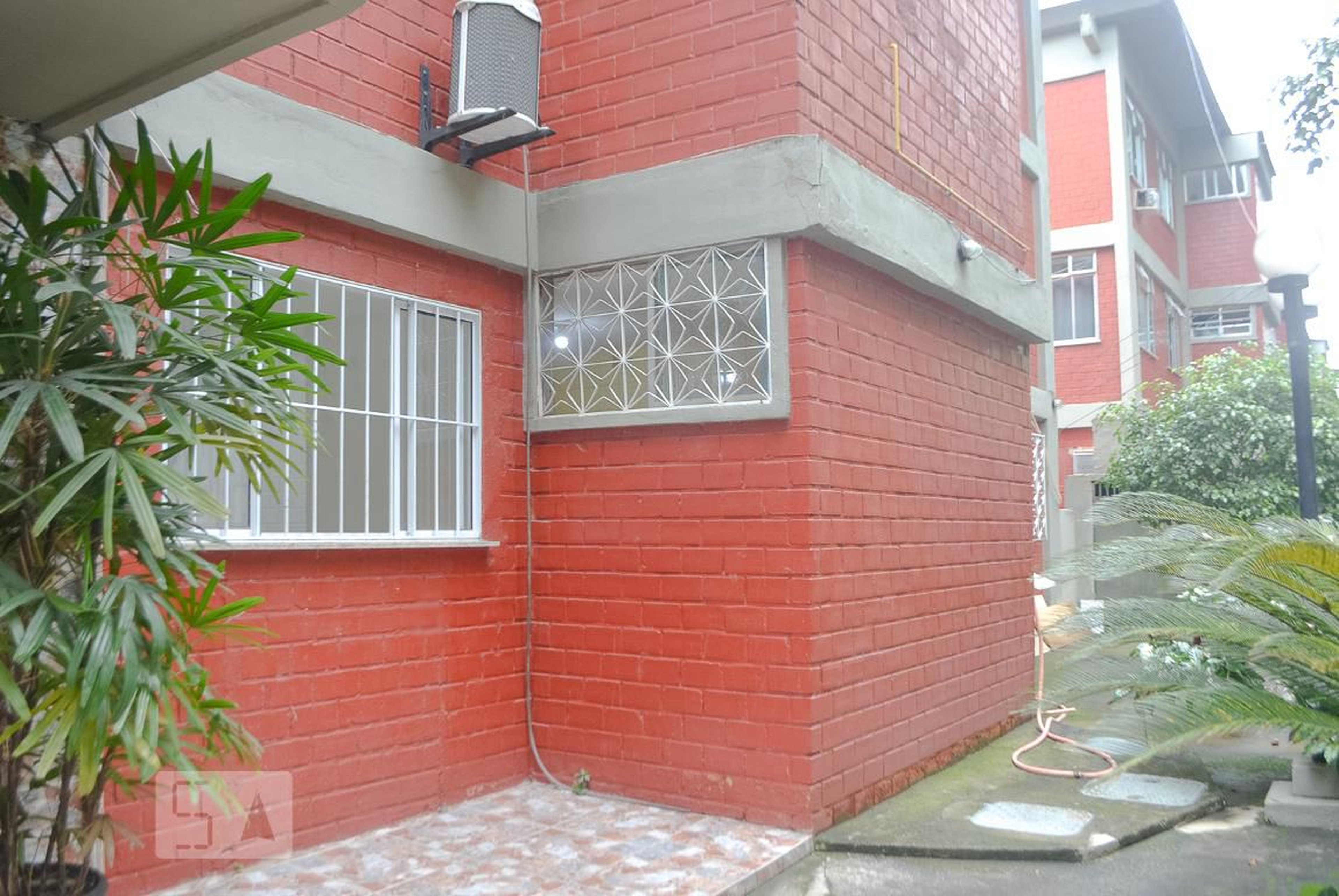 Fachada Condomínio em Rua Wilde Lustoza, 111