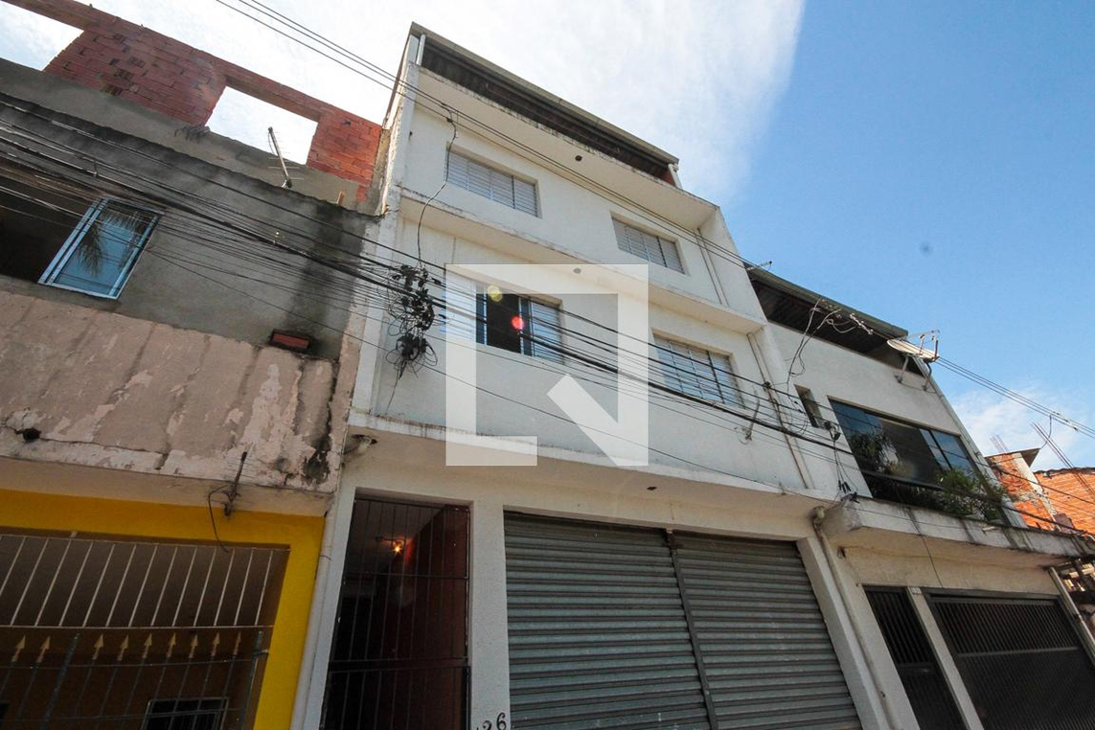 Fachada Condomínio em Rua Elói Mendes, 126