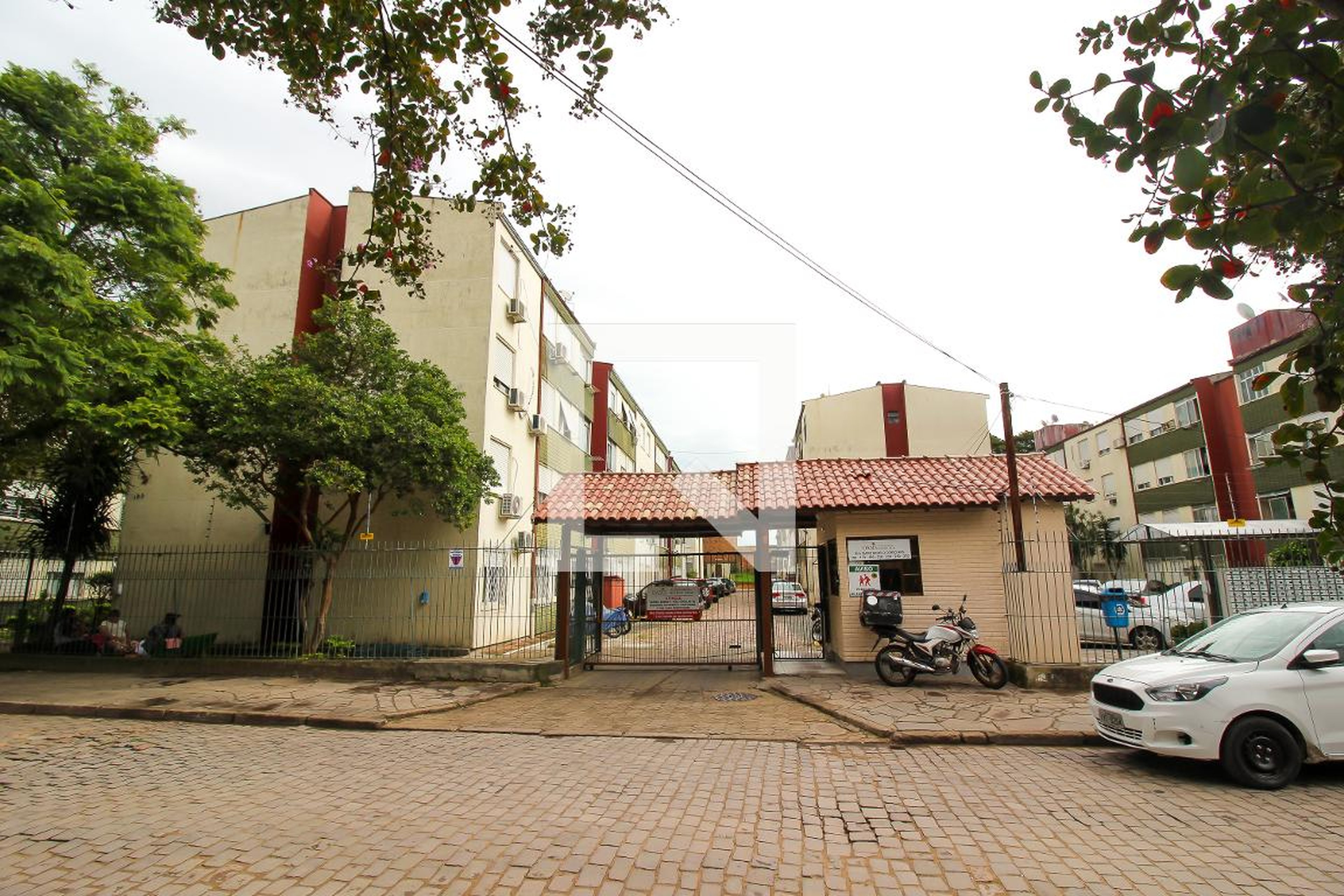 Fachada do Condomínio Condomínio Oásis