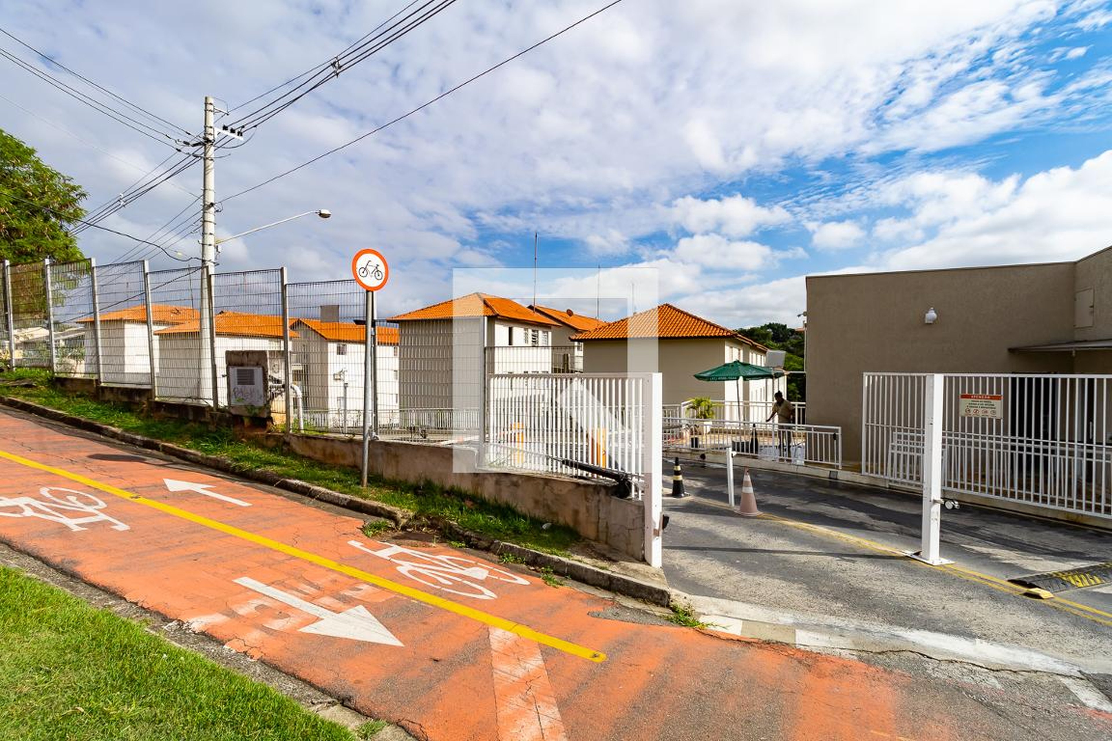 Fachada do Condomínio Condomínio Alpha