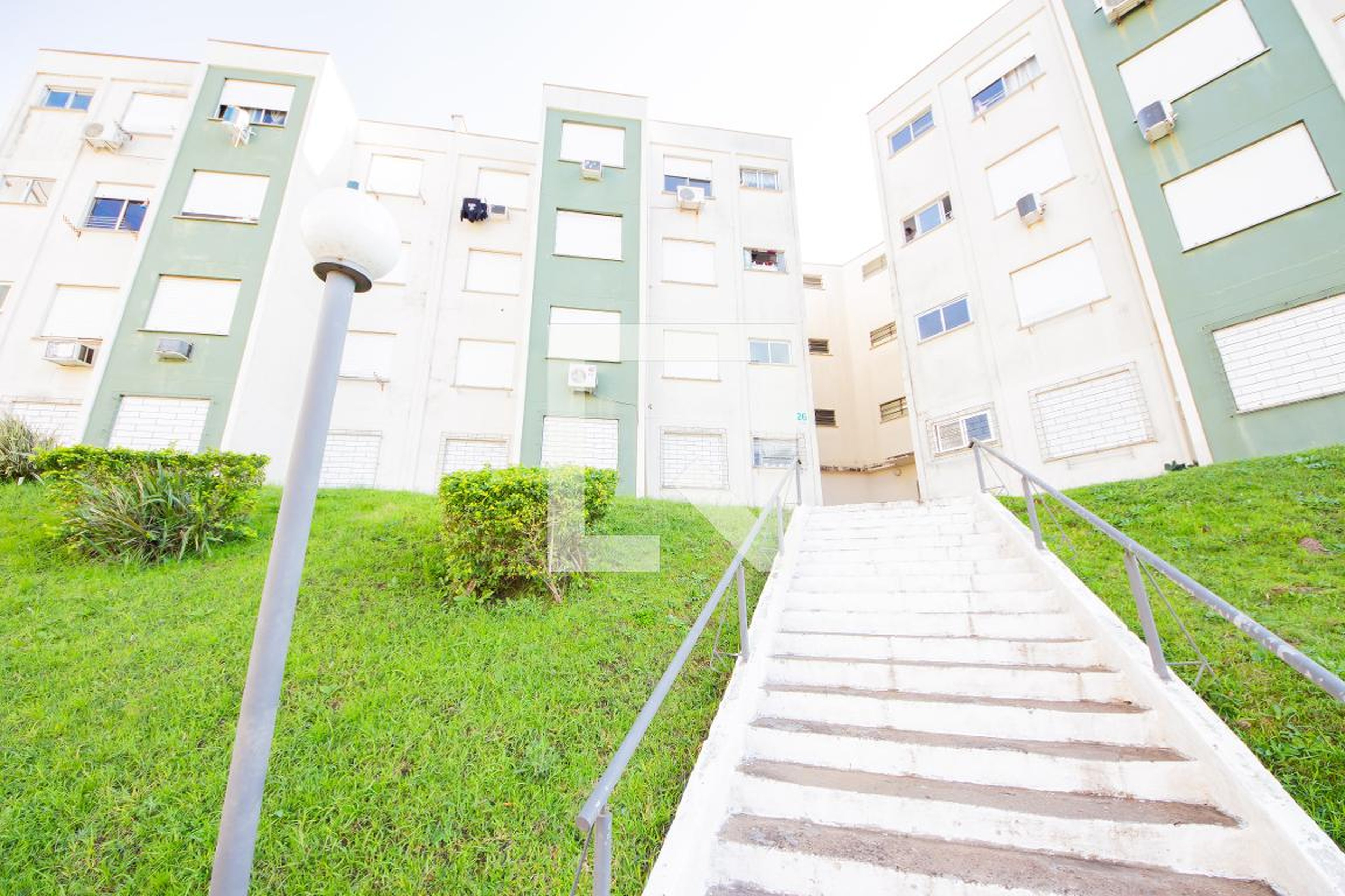 Fachada Condomínio em Rua Tenente Ary Tarragô, 244