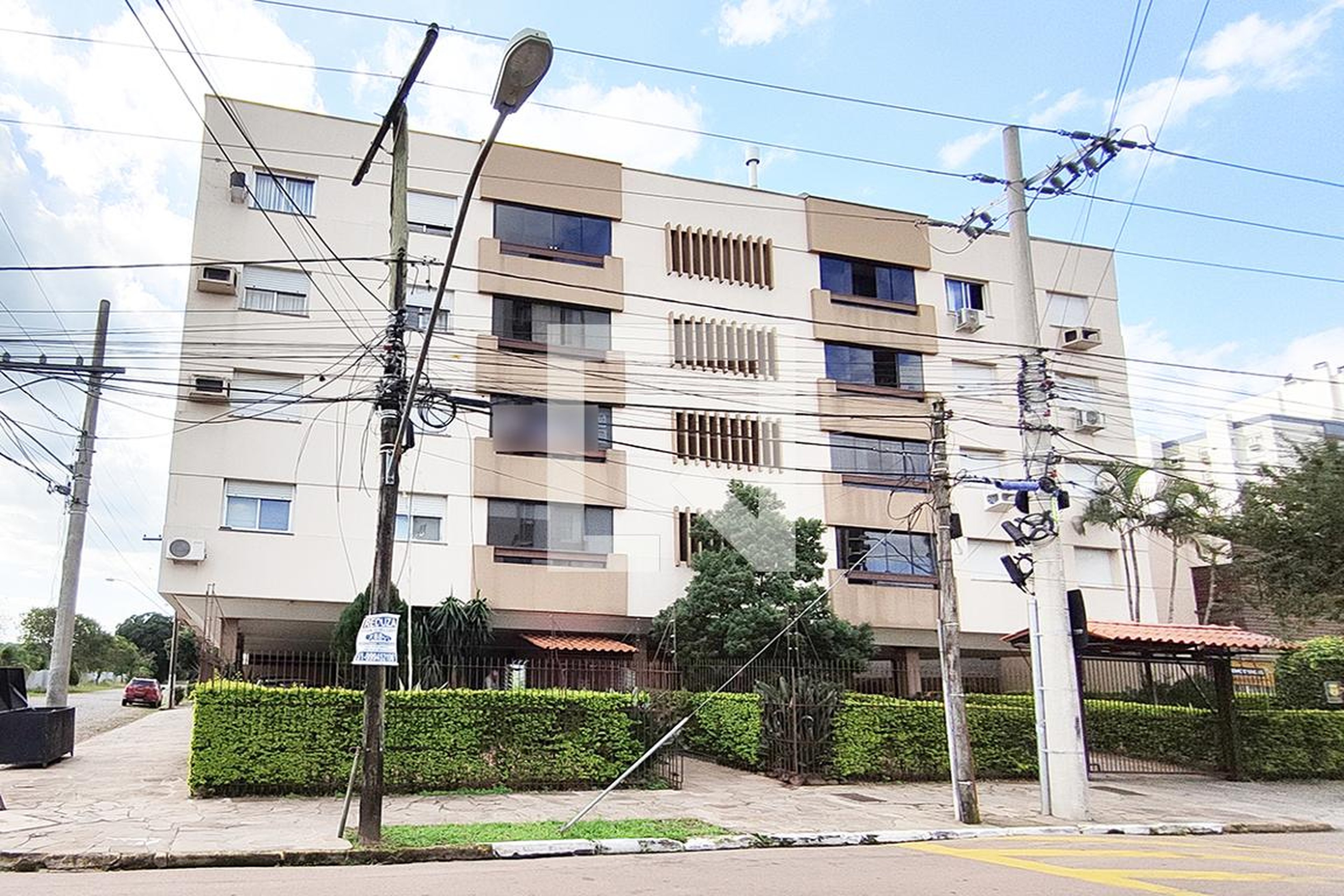 Fachada do Condomínio Edifício Petit Villagem