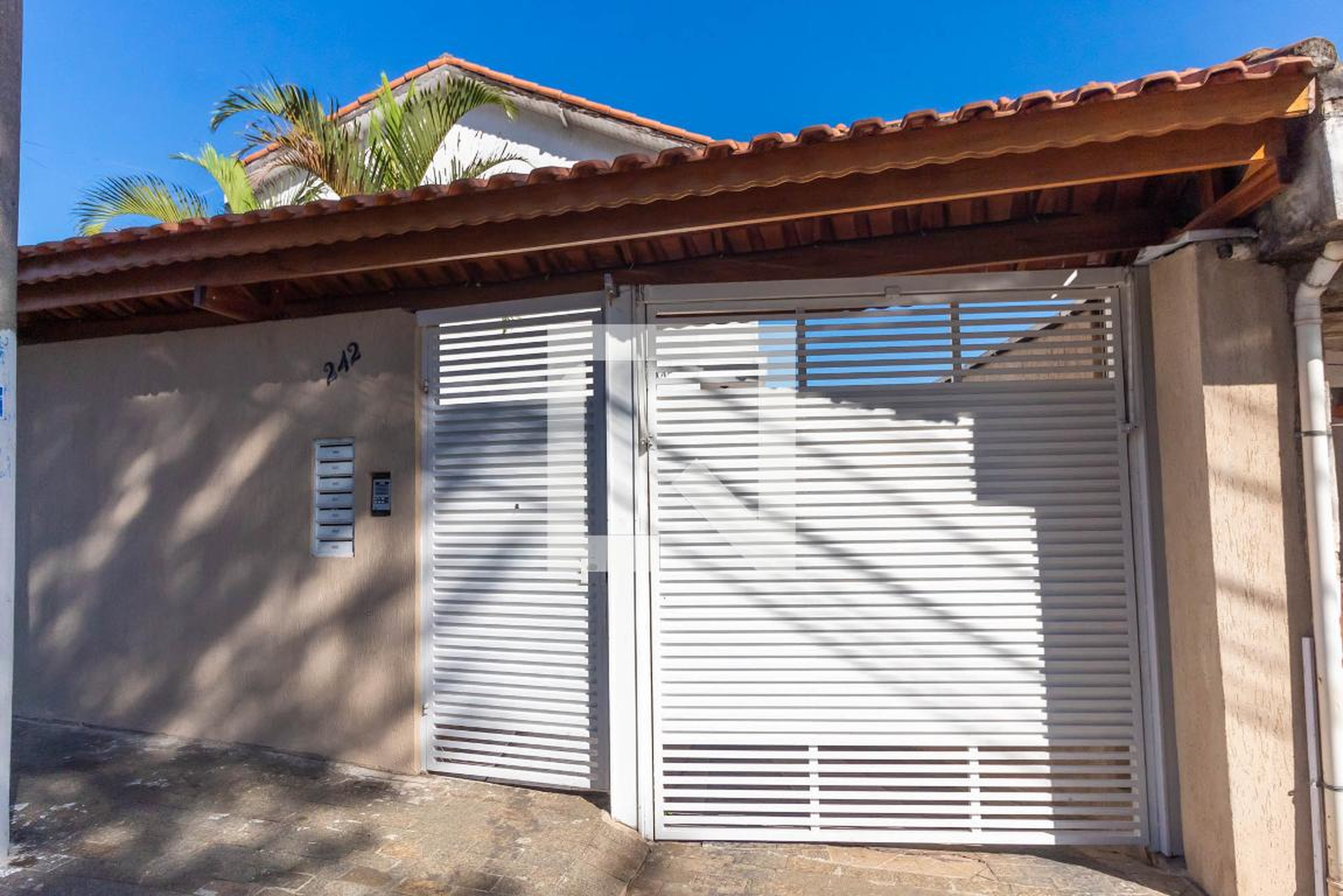 Fachada Condomínio em Rua Plínio Reis, 242