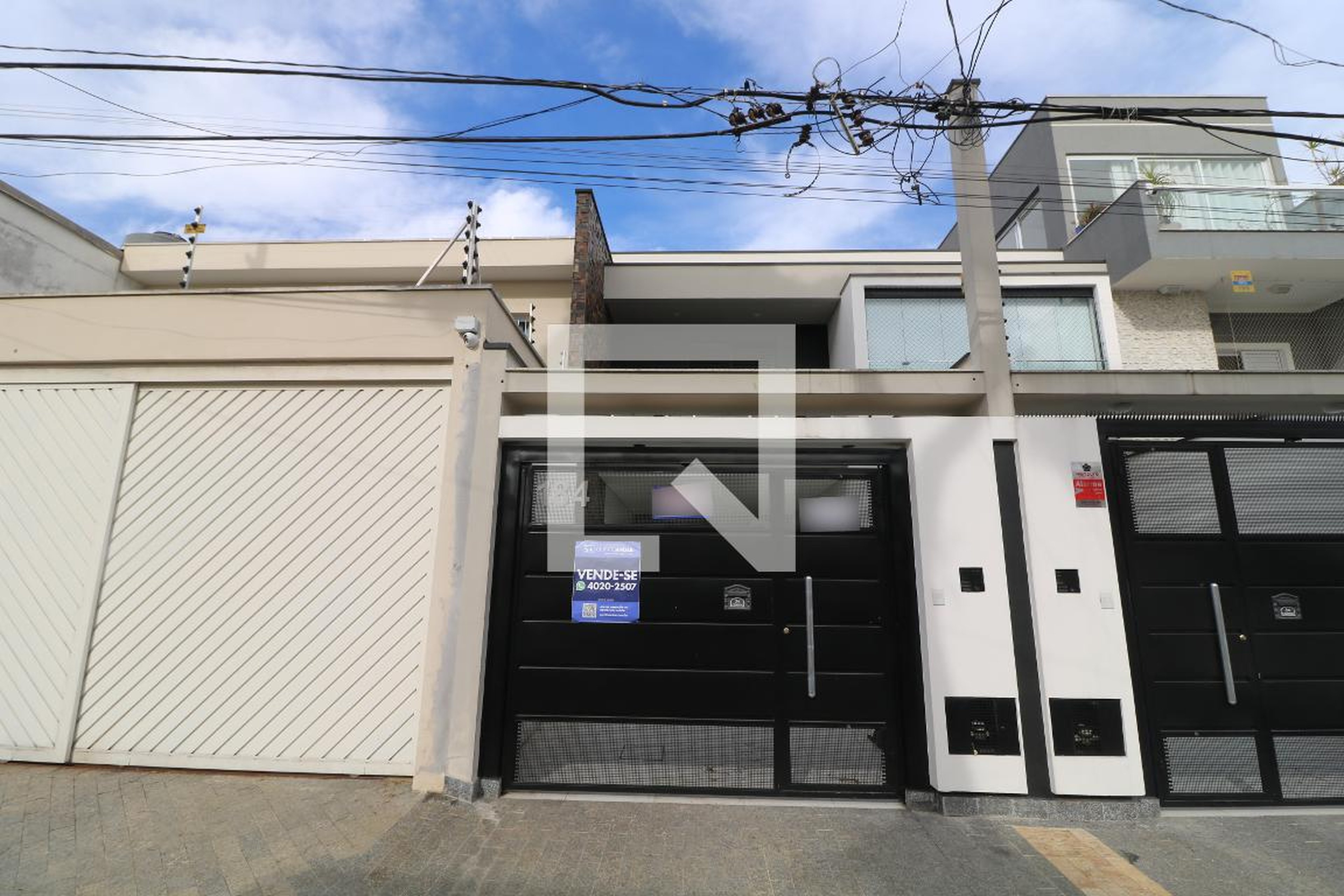 Fachada Condomínio em Rua Henrique Xavier, 184