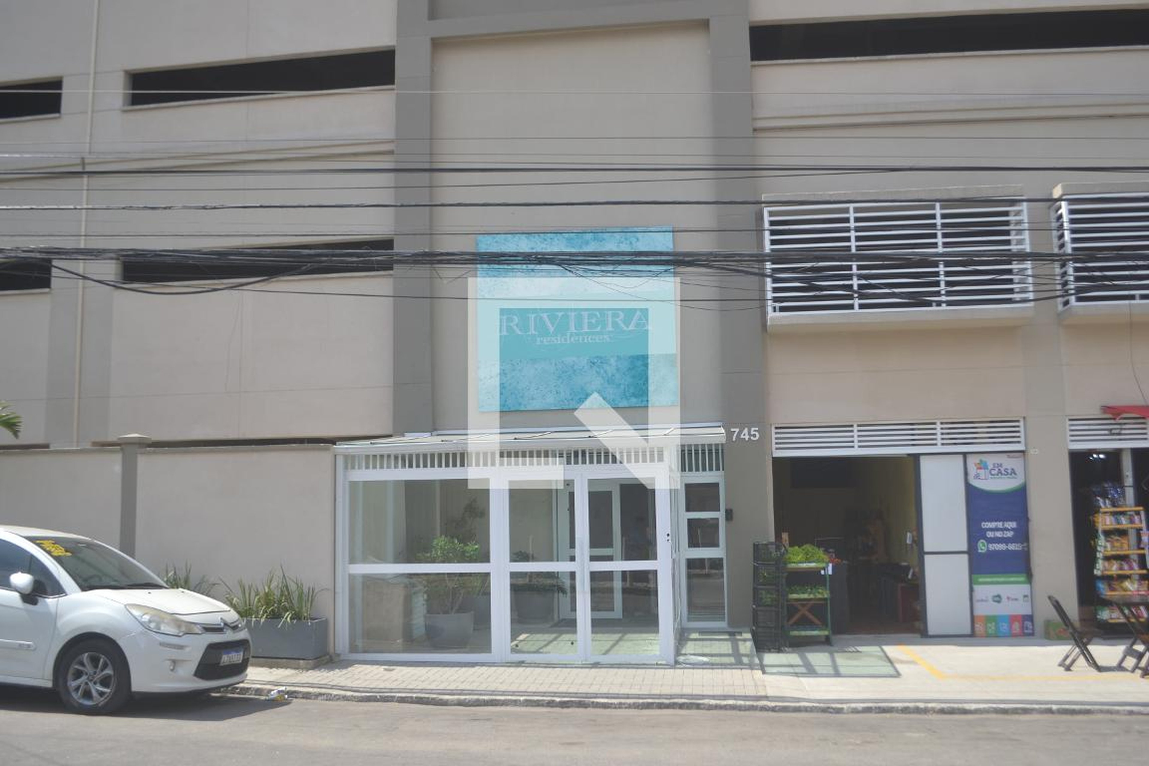 Fachada do Condomínio Condomínio Riviera Residences