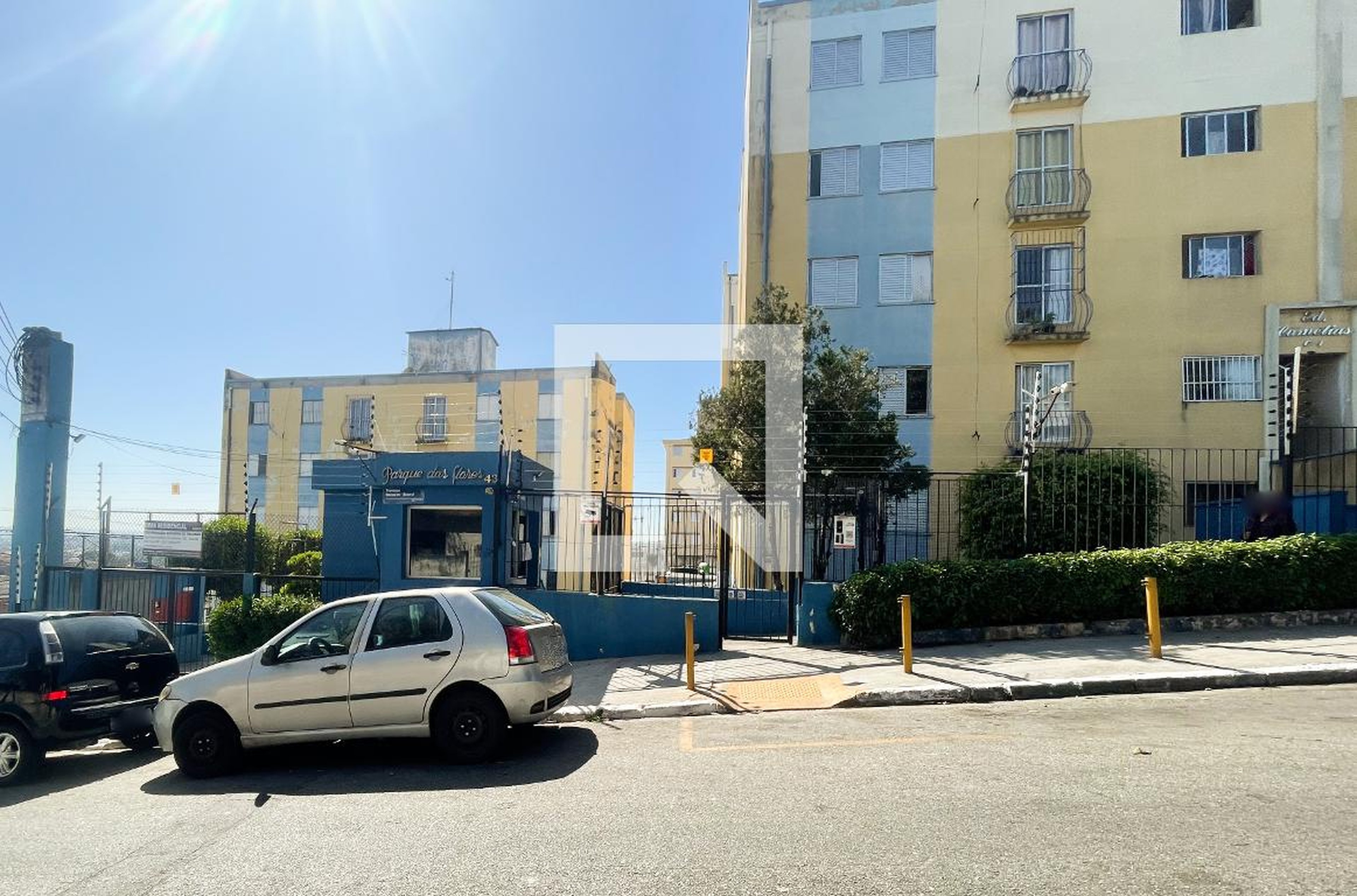 Fachada do Condomínio Condomínio Parque das flores