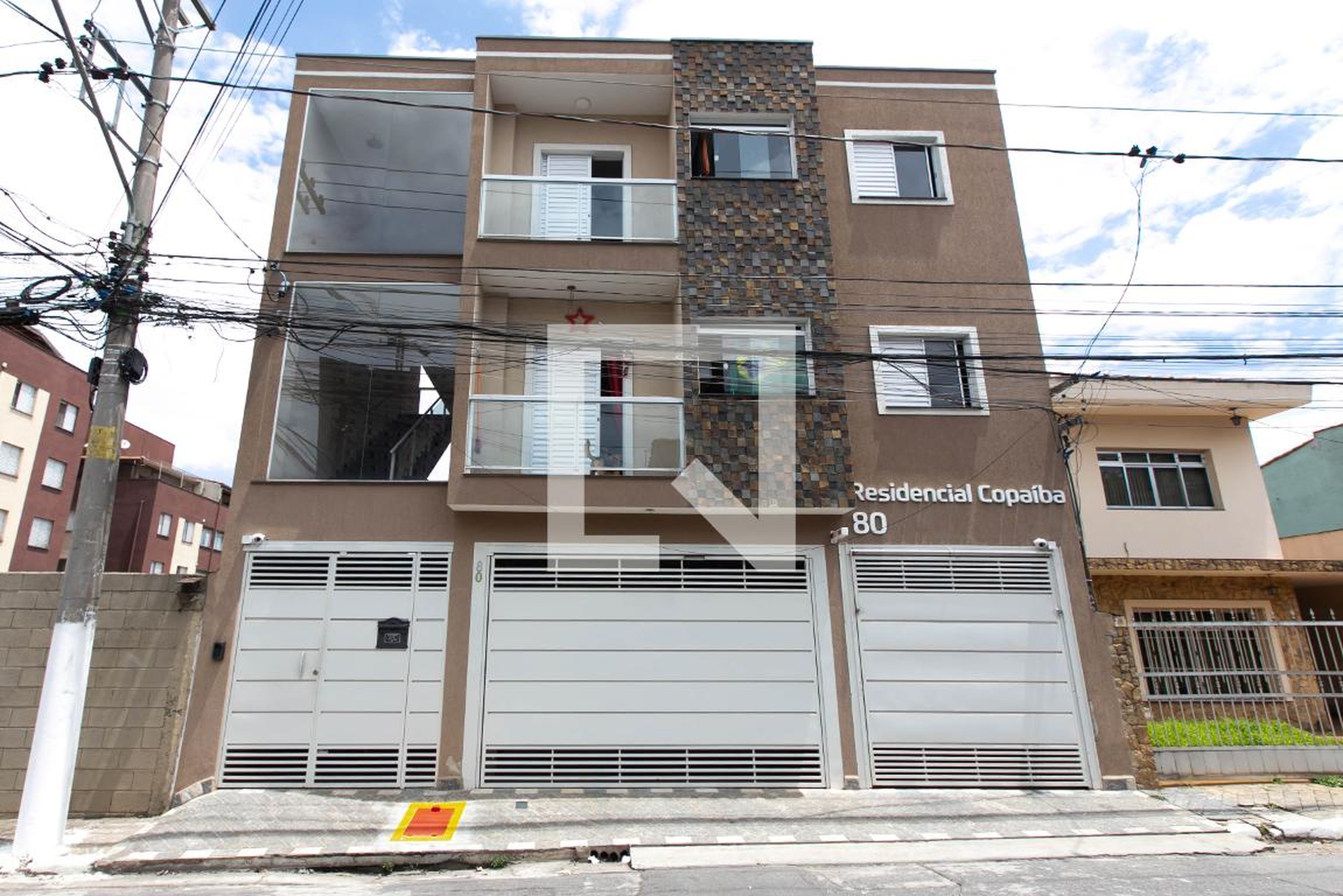 Fachada do Condomínio Condomínio Copaíba