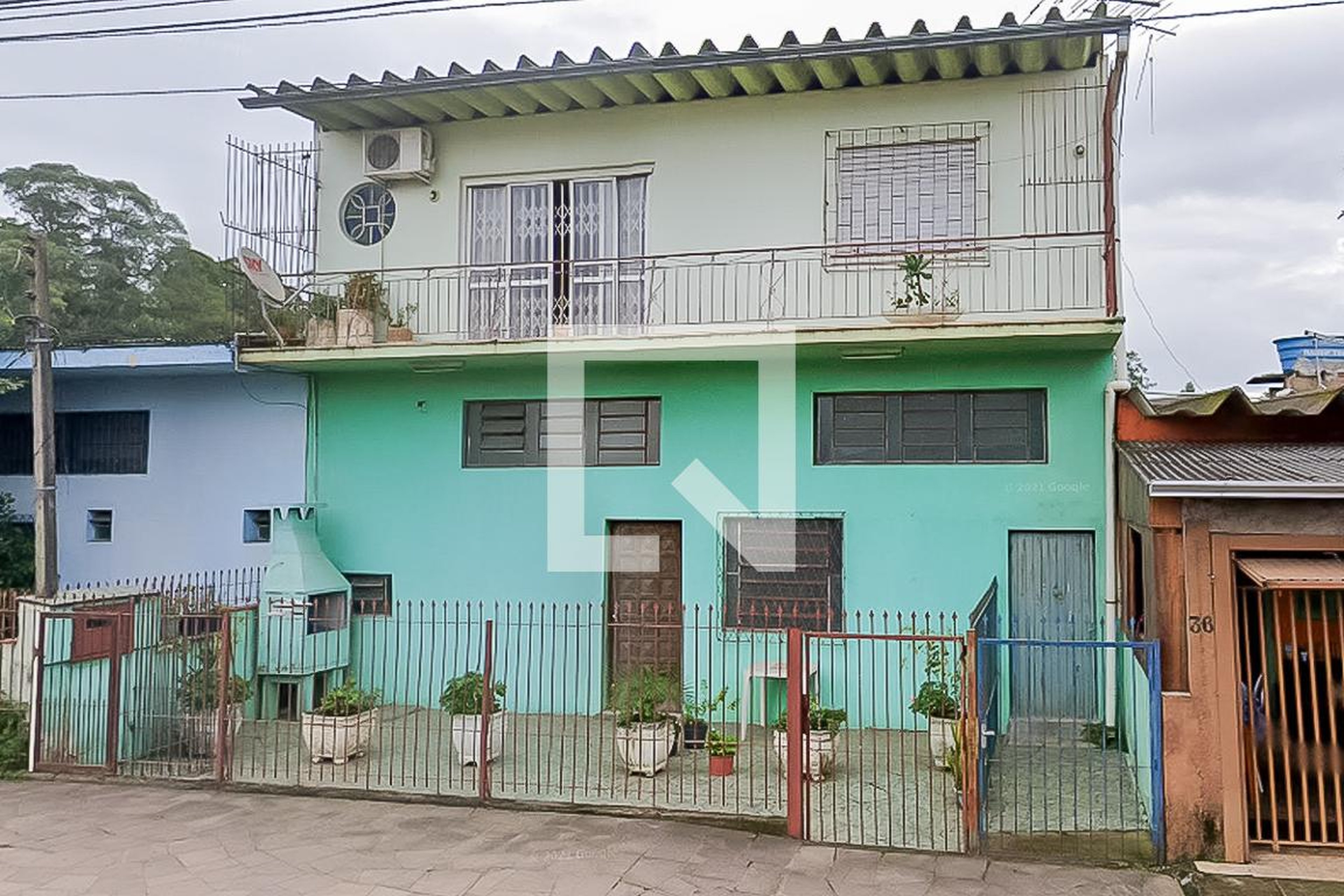 Fachada Condomínio em Rua Travessão, 480