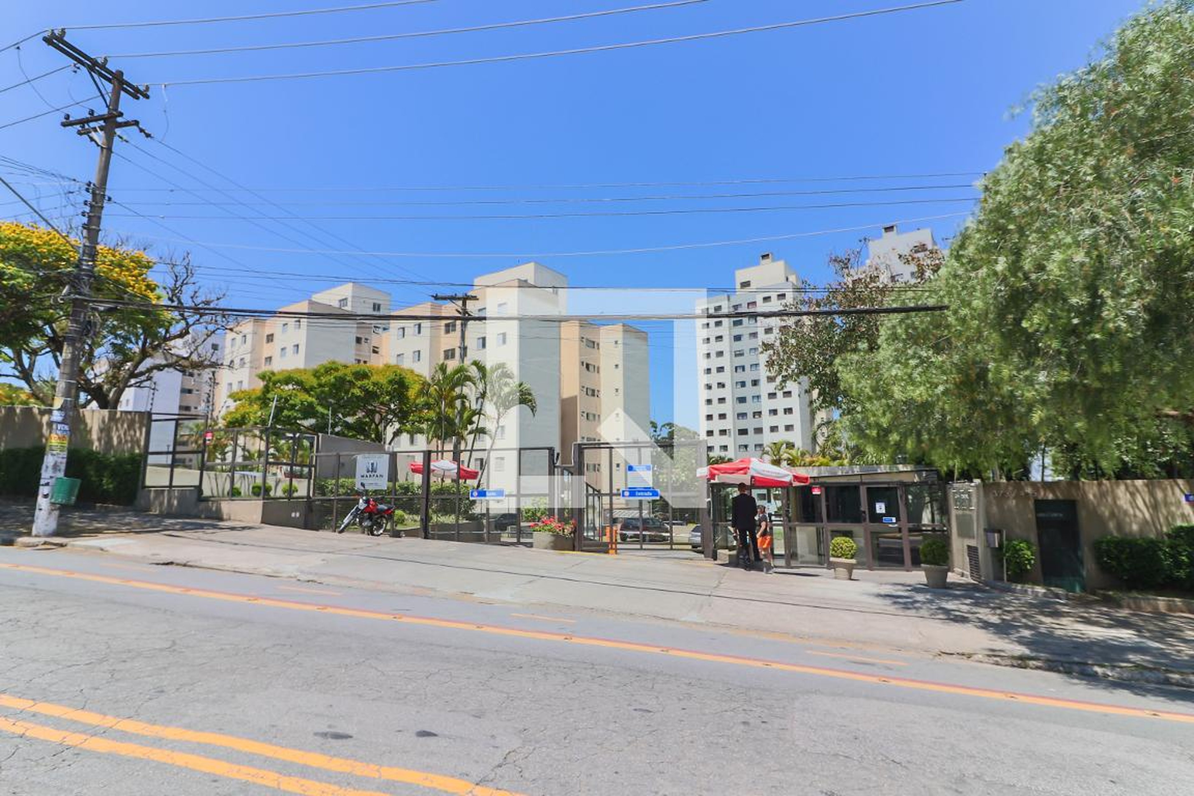 Fachada do Condomínio Condomínio Cosmos