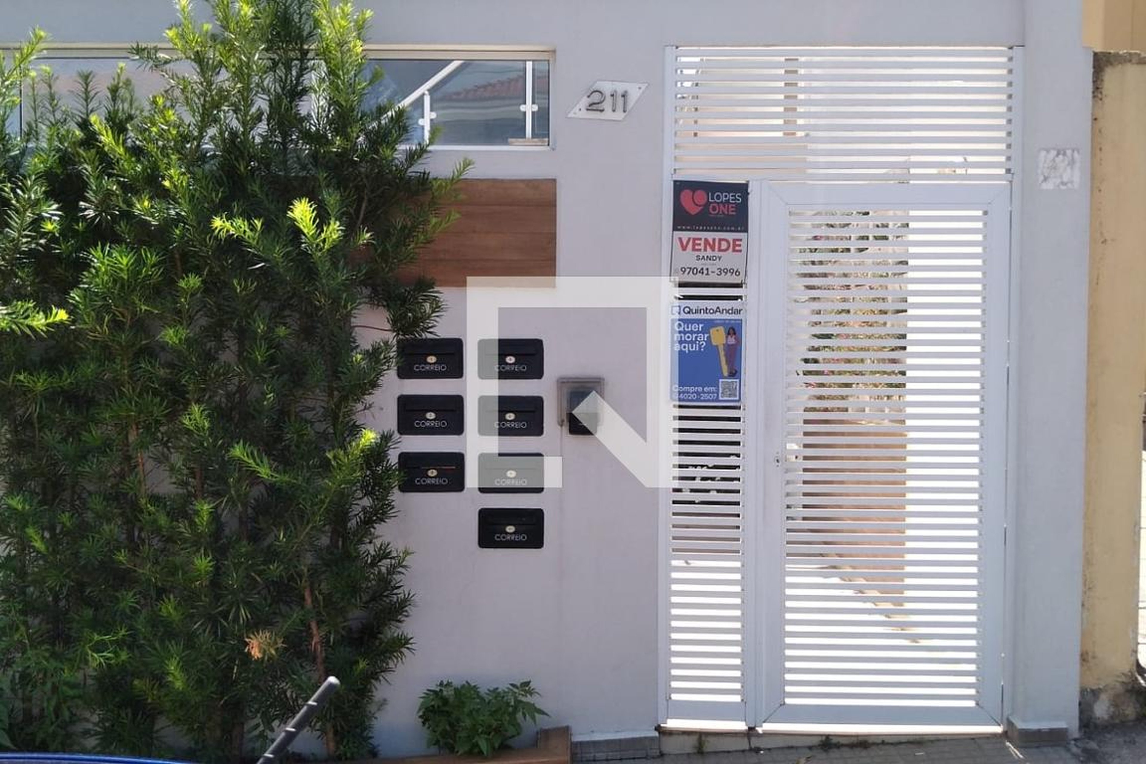 Fachada Condomínio em Rua Caçador, 211