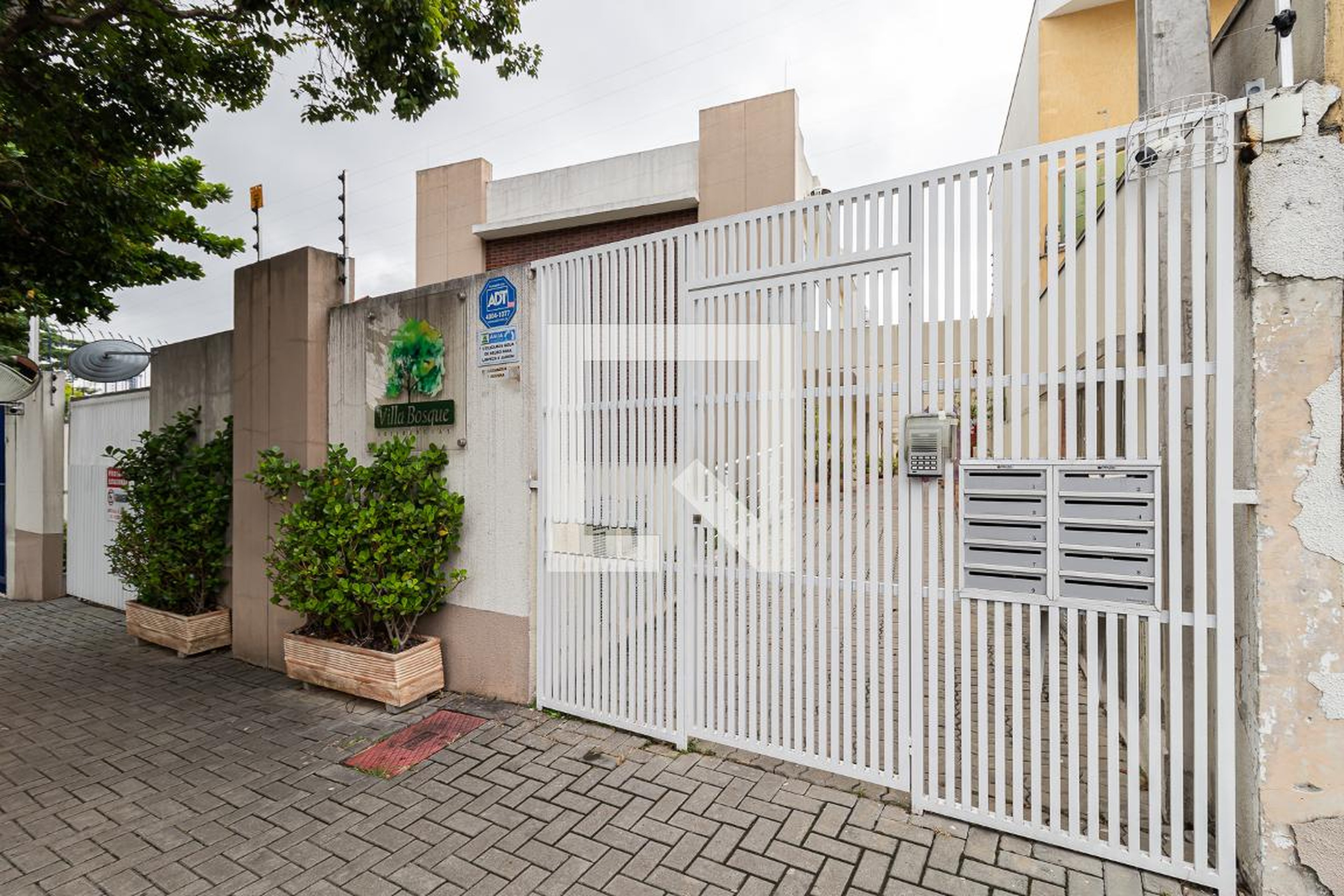 Fachada do Condomínio Condomínio Villa Bosque