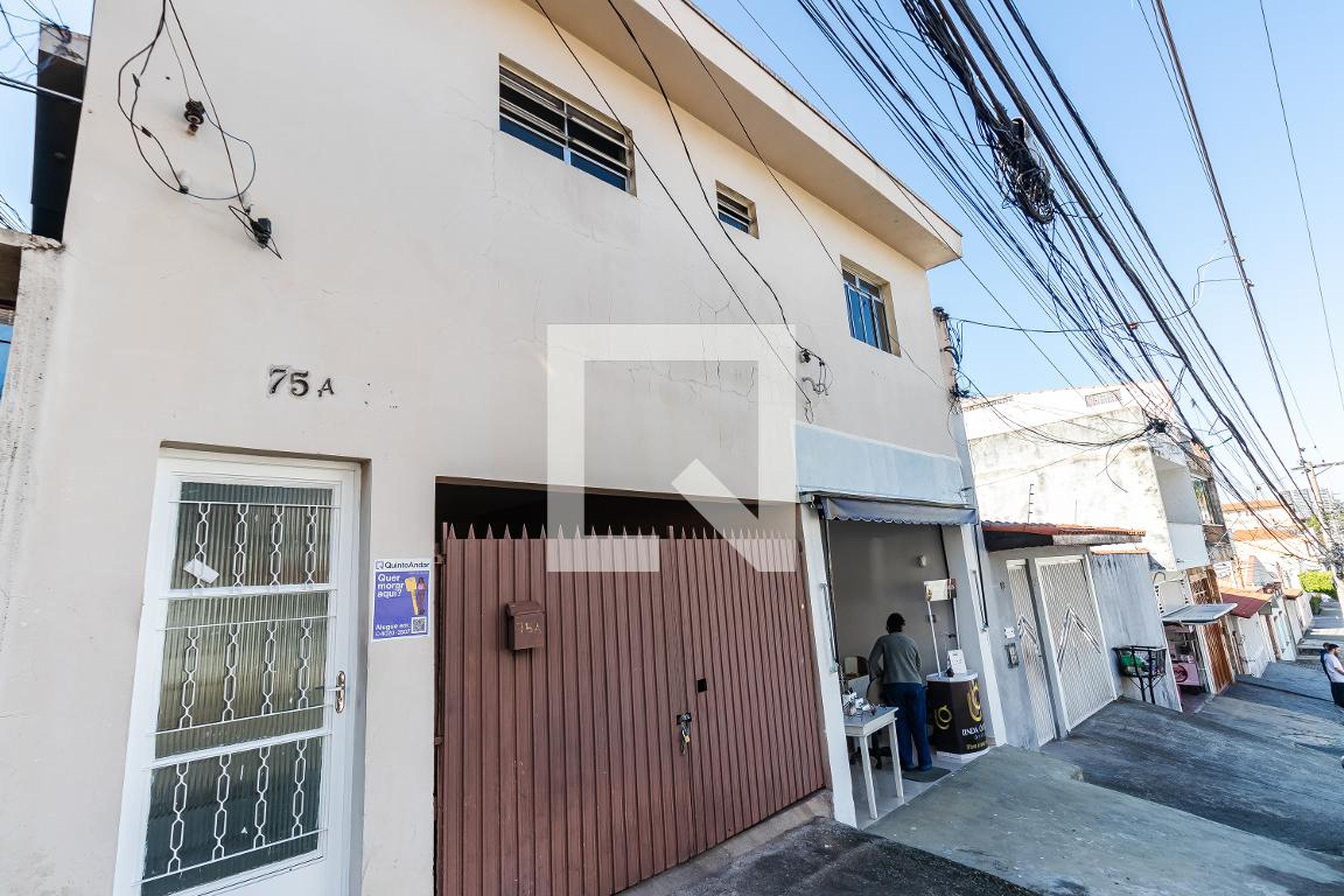 Fachada Condomínio em Rua Siqueira Silva, 75