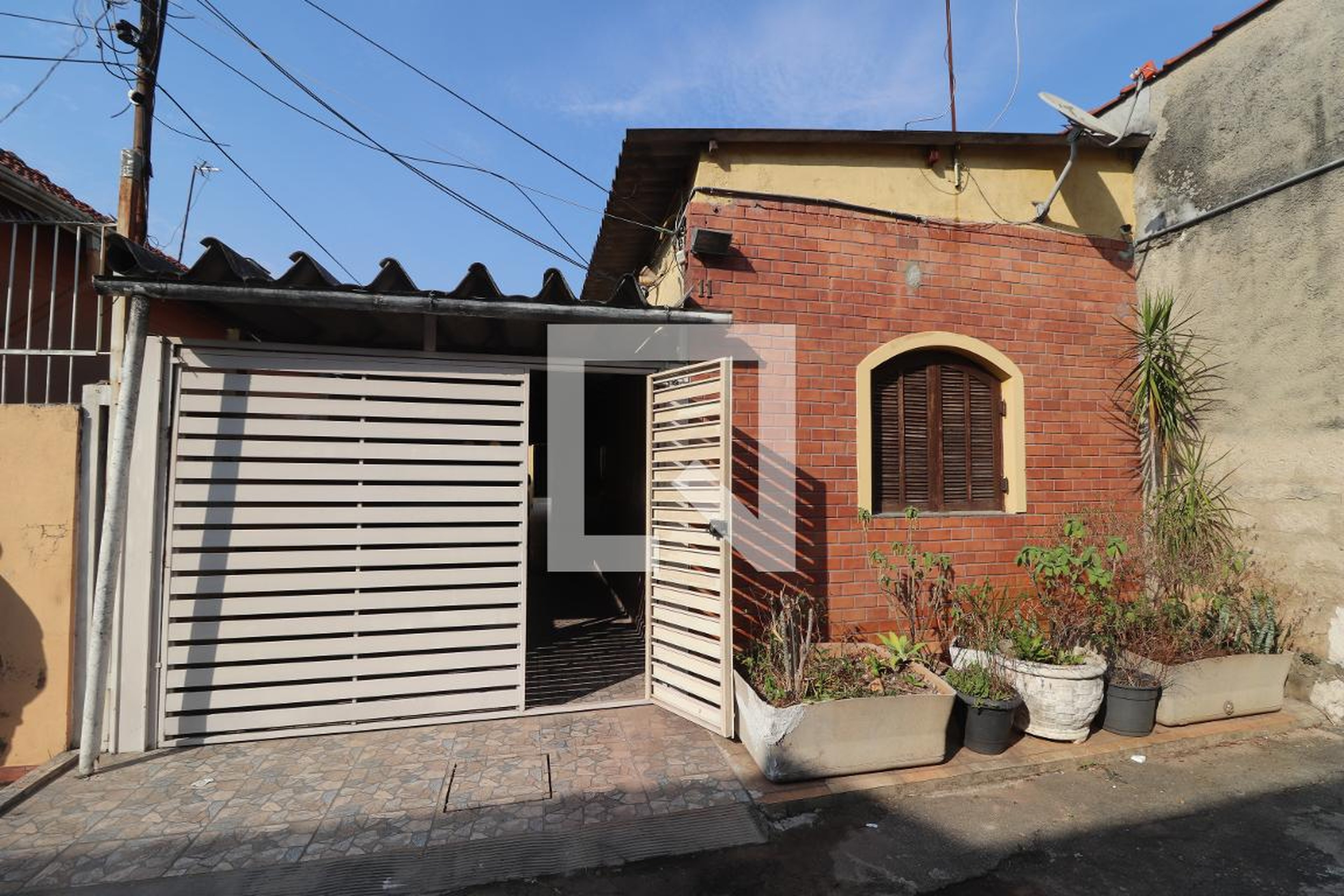 Fachada Condomínio em Rua Horácio Hora, 11