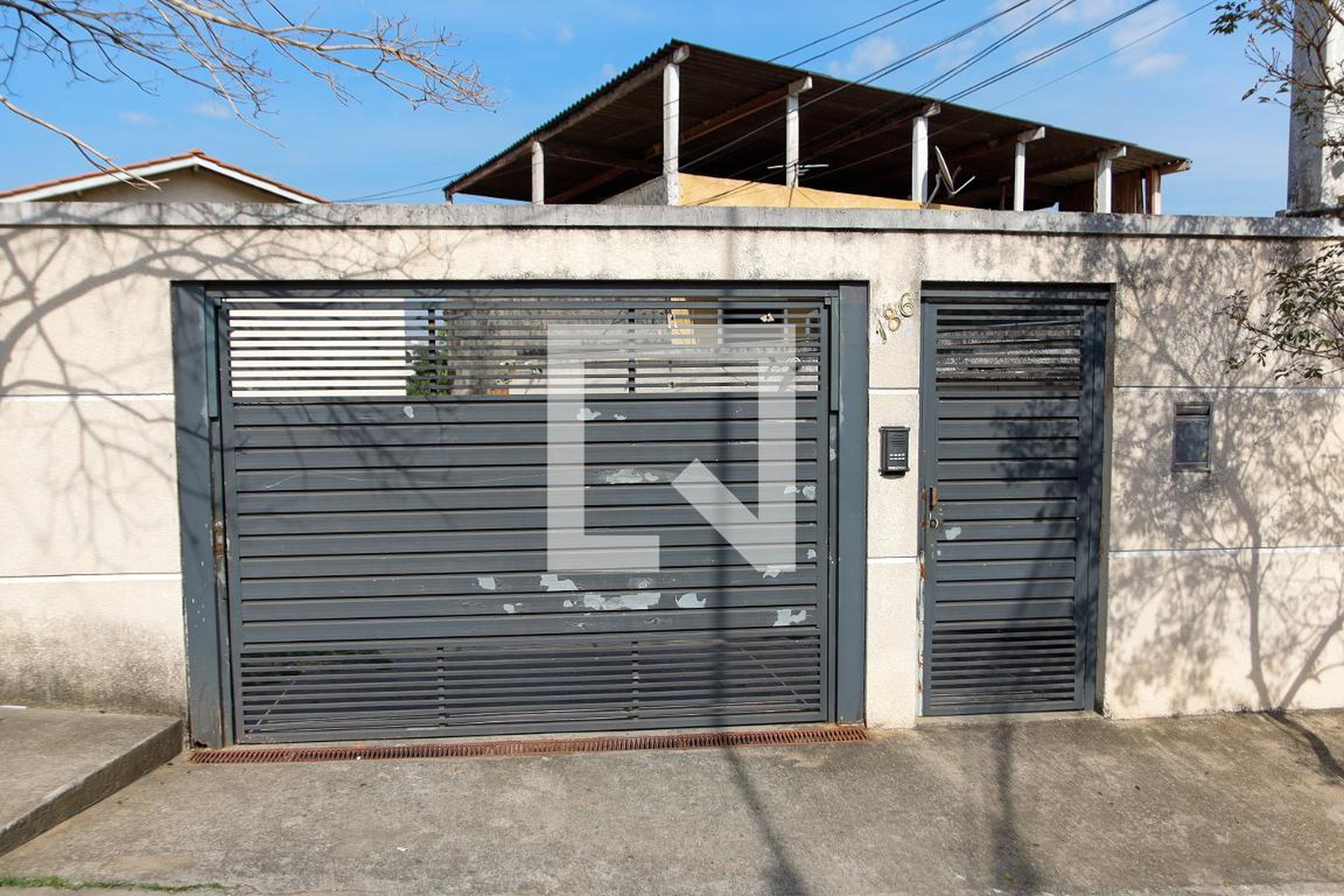 Fachada Condomínio em Rua Doutor Miguel Nahka, 186