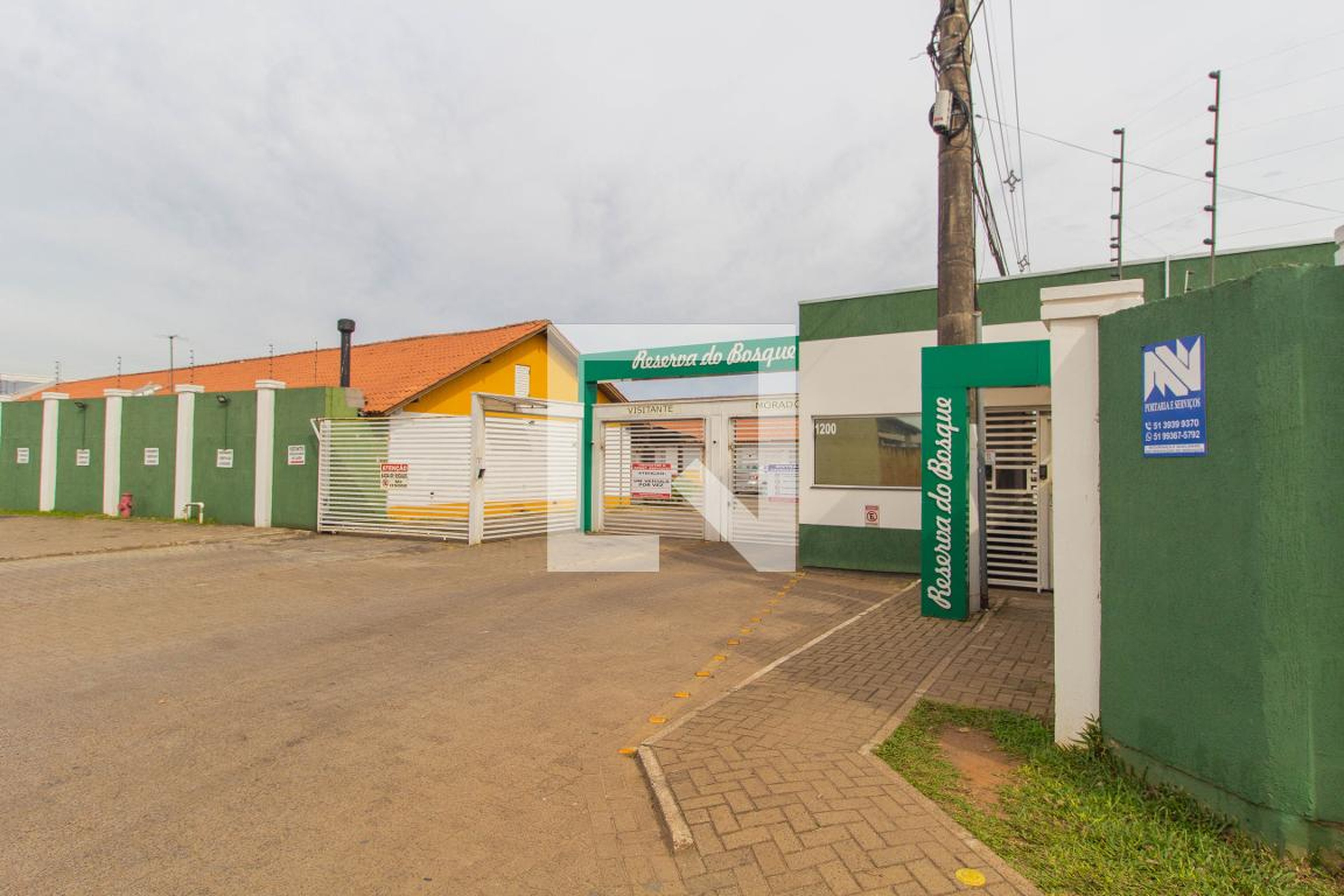 Fachada do Condomínio Condomínio Reserva do Bosque