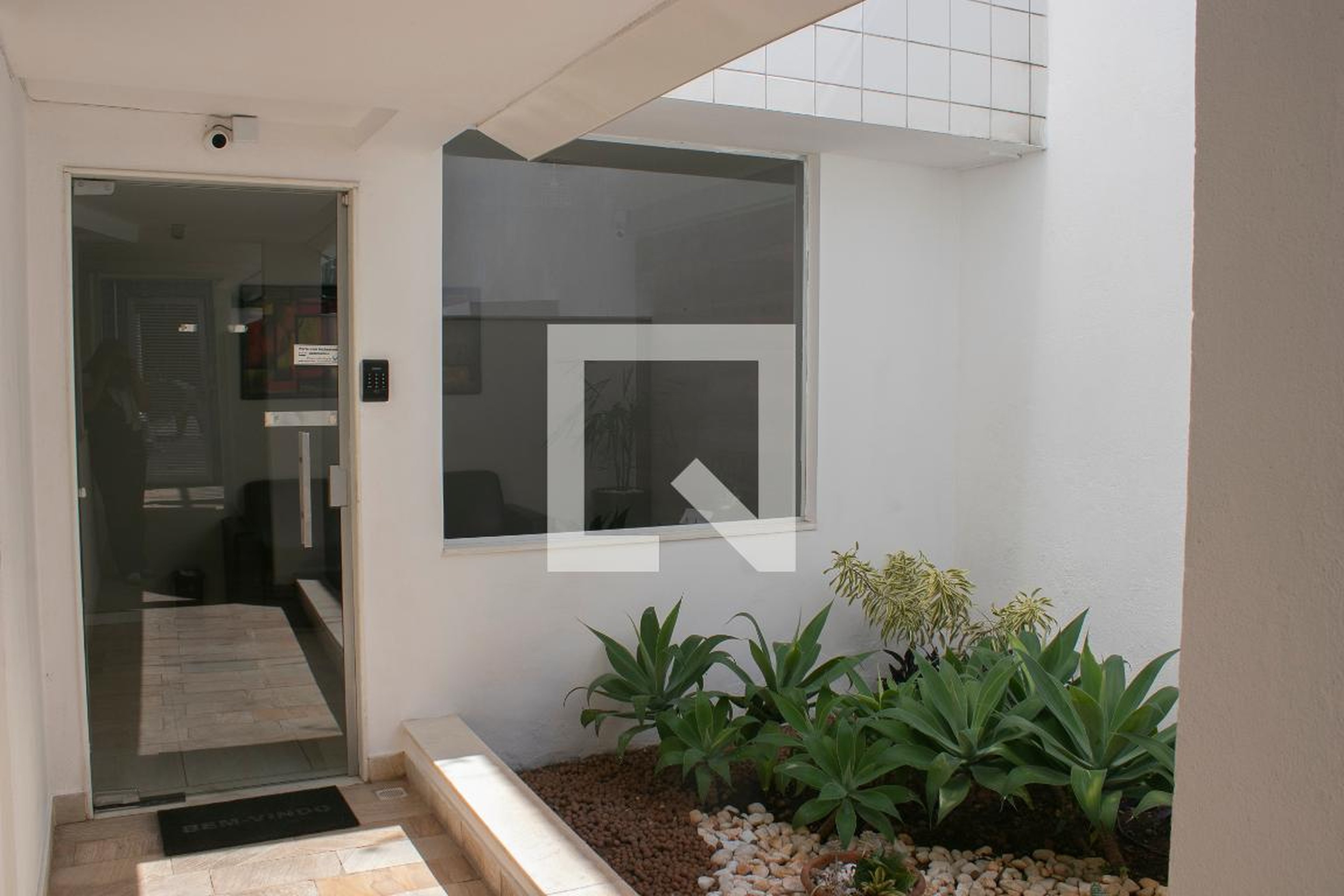 Hall de entrada Condomínio em Rua Almandina, 55