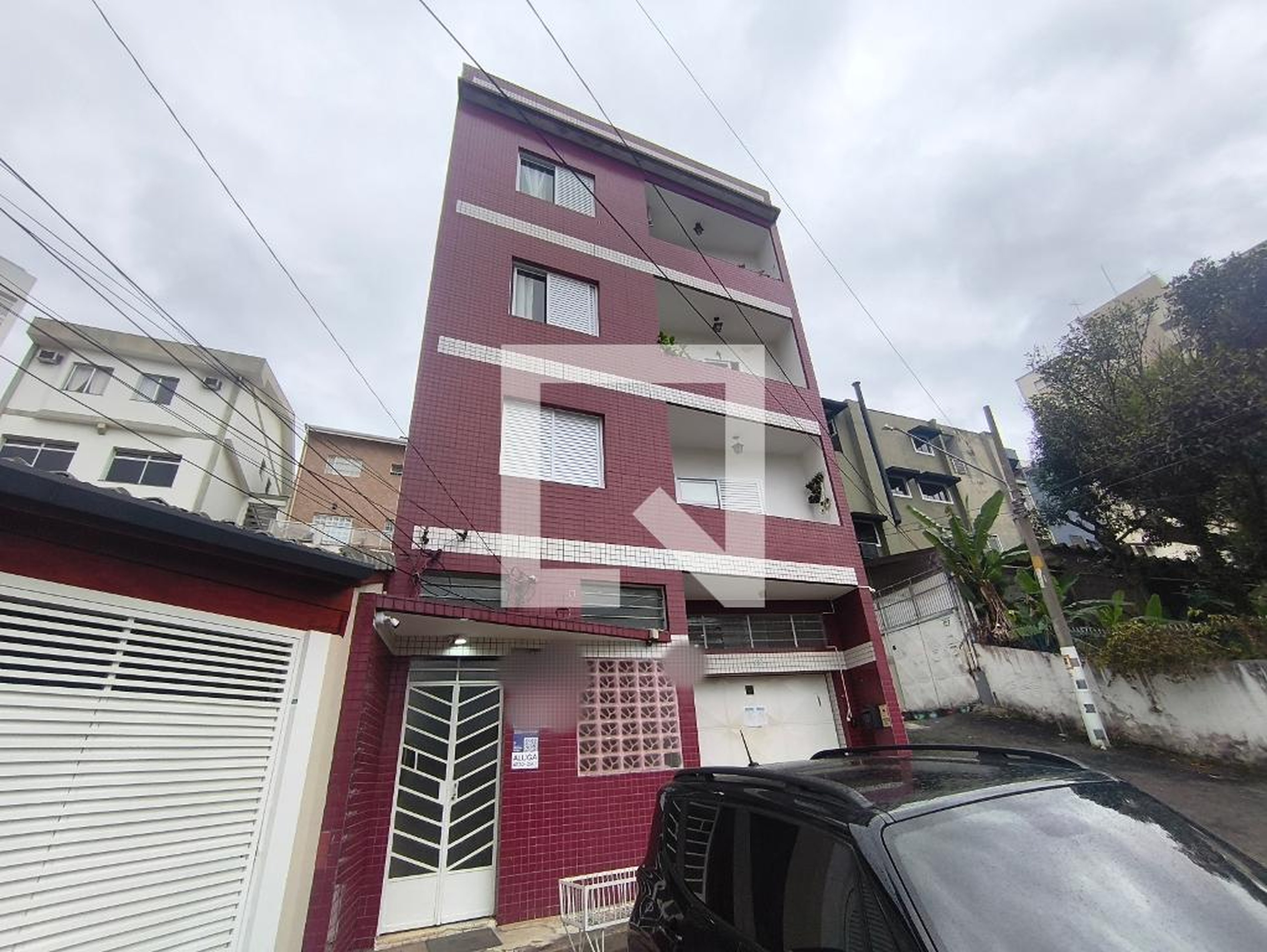 Fachada Condomínio em Rua Vieira de Moura, 111