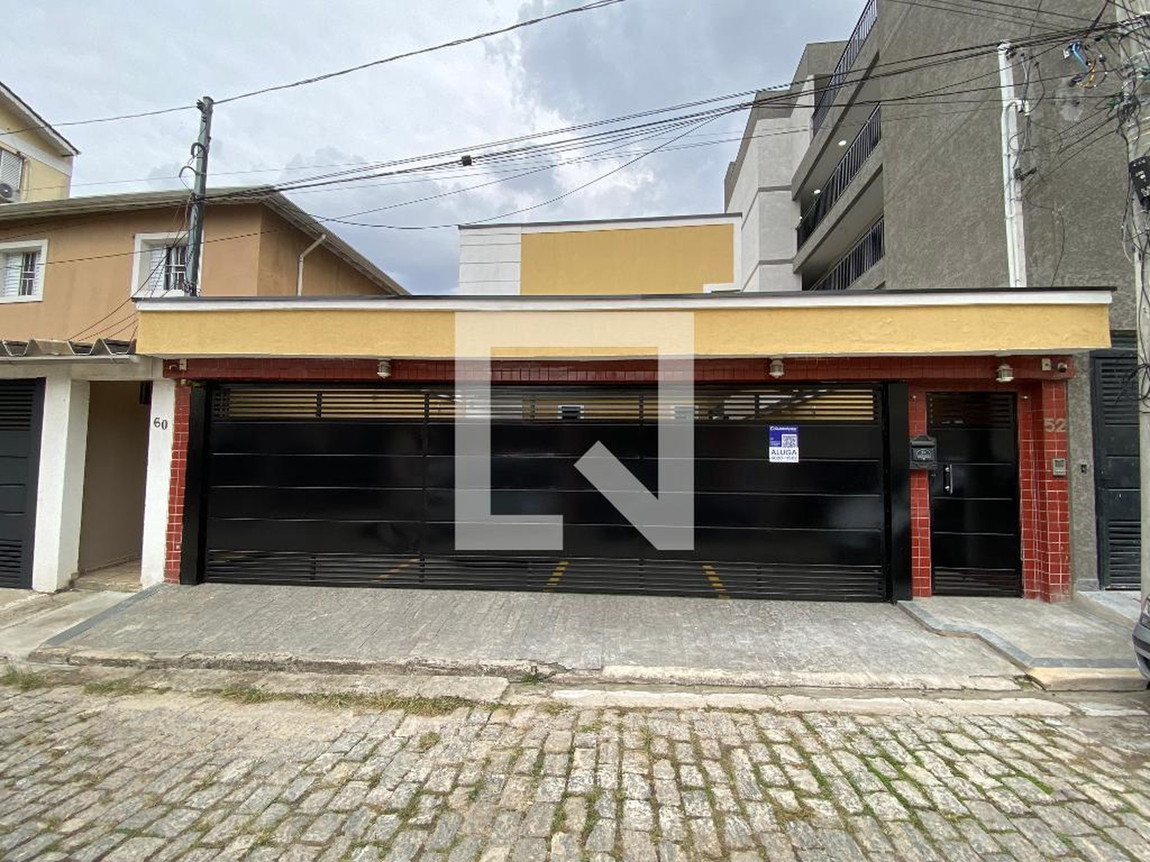 Fachada Condomínio em Rua Capigaí, 52