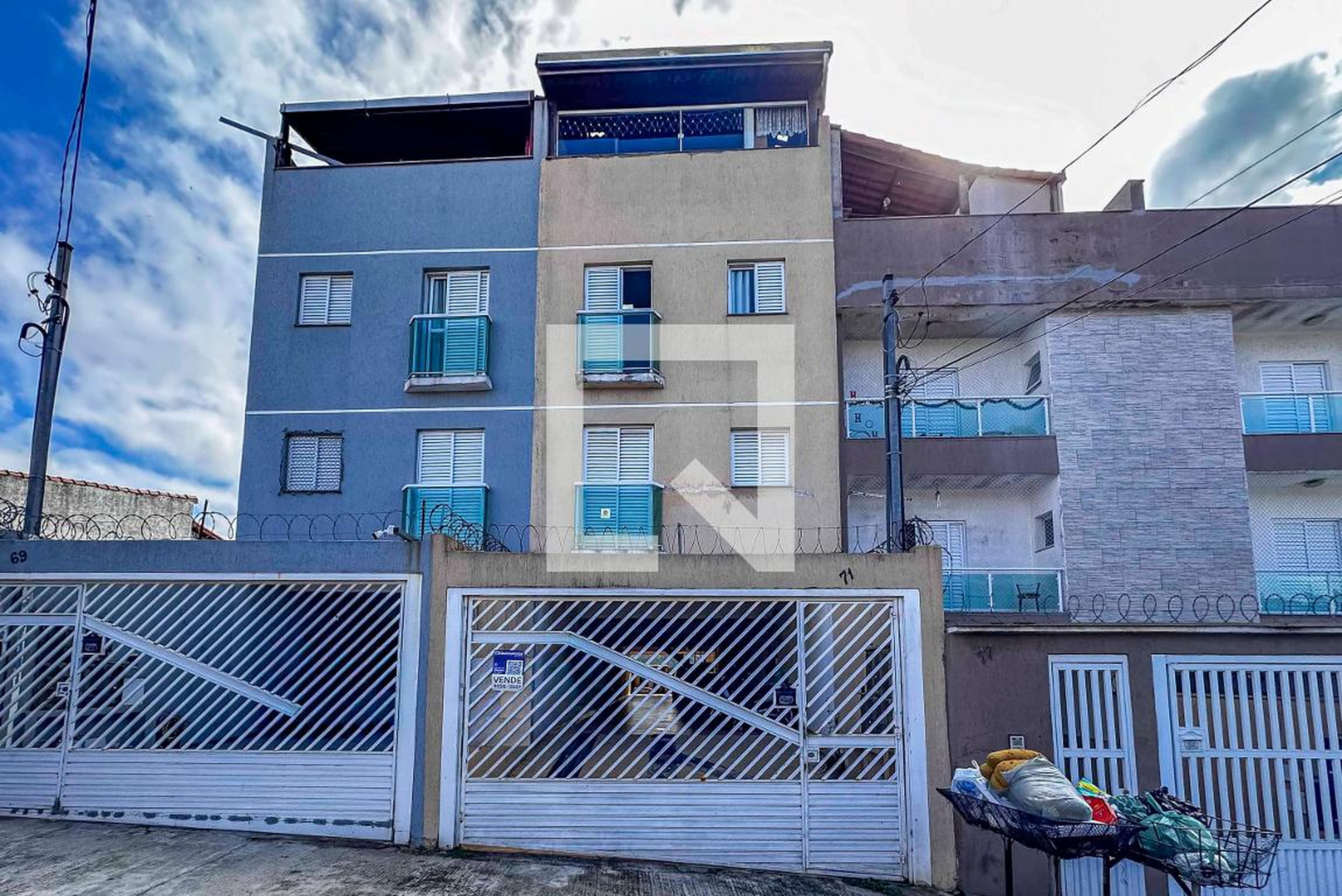 Fachada Condomínio em Rua Biguá, 71