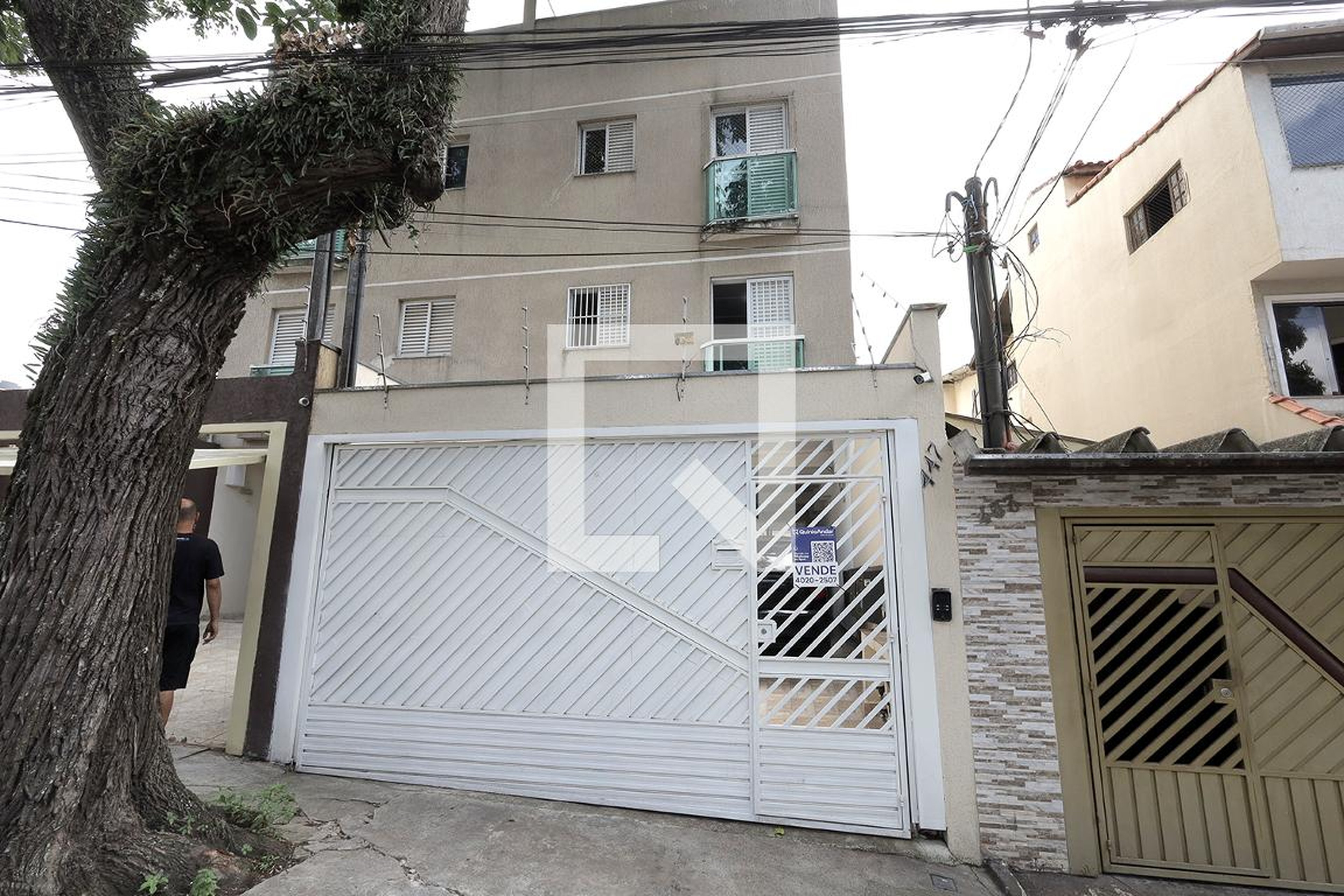 Fachada Condomínio em Rua Guimarães Passos, 447