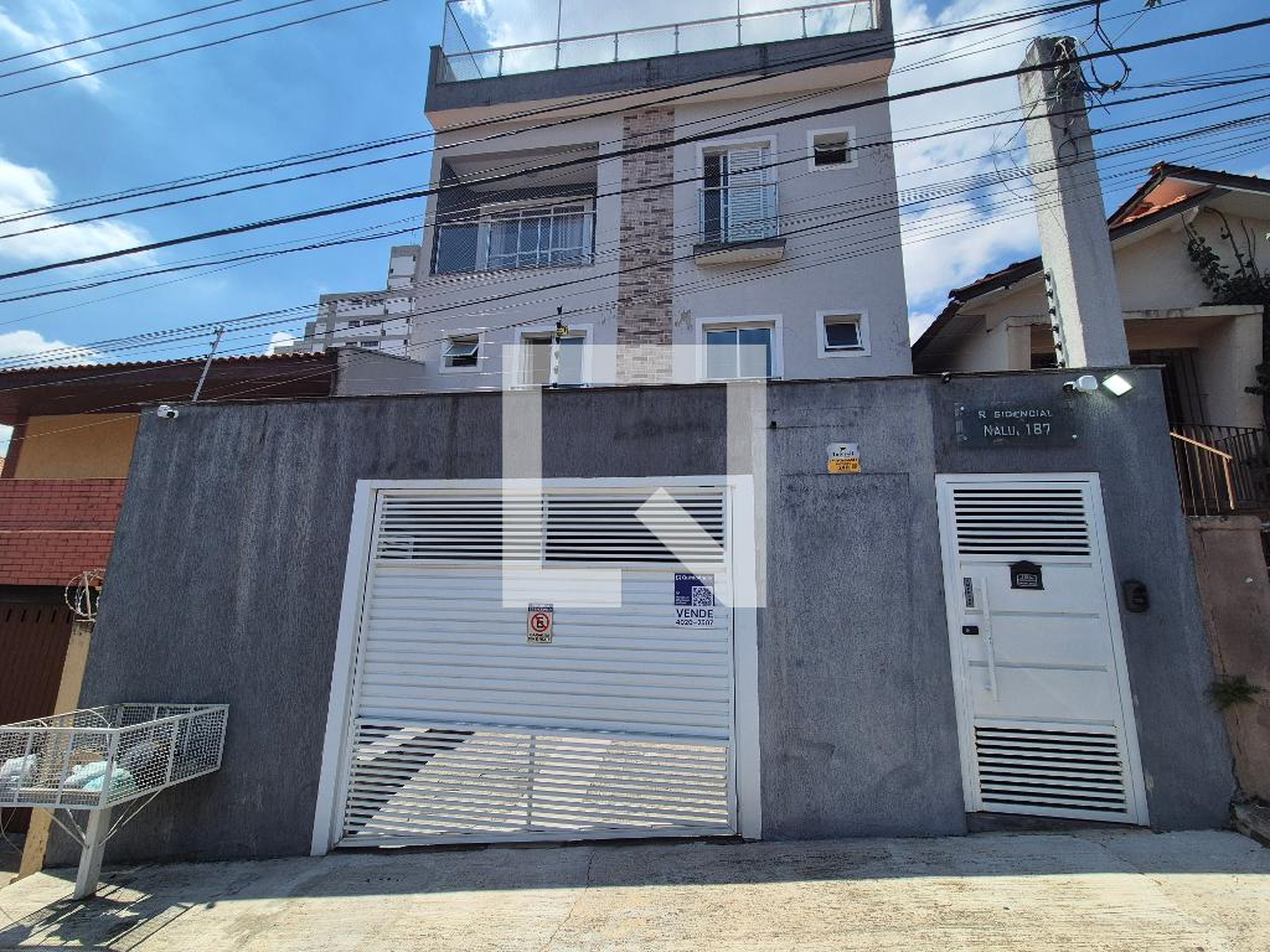 Fachada Condomínio em Rua Luís Delfino, 143