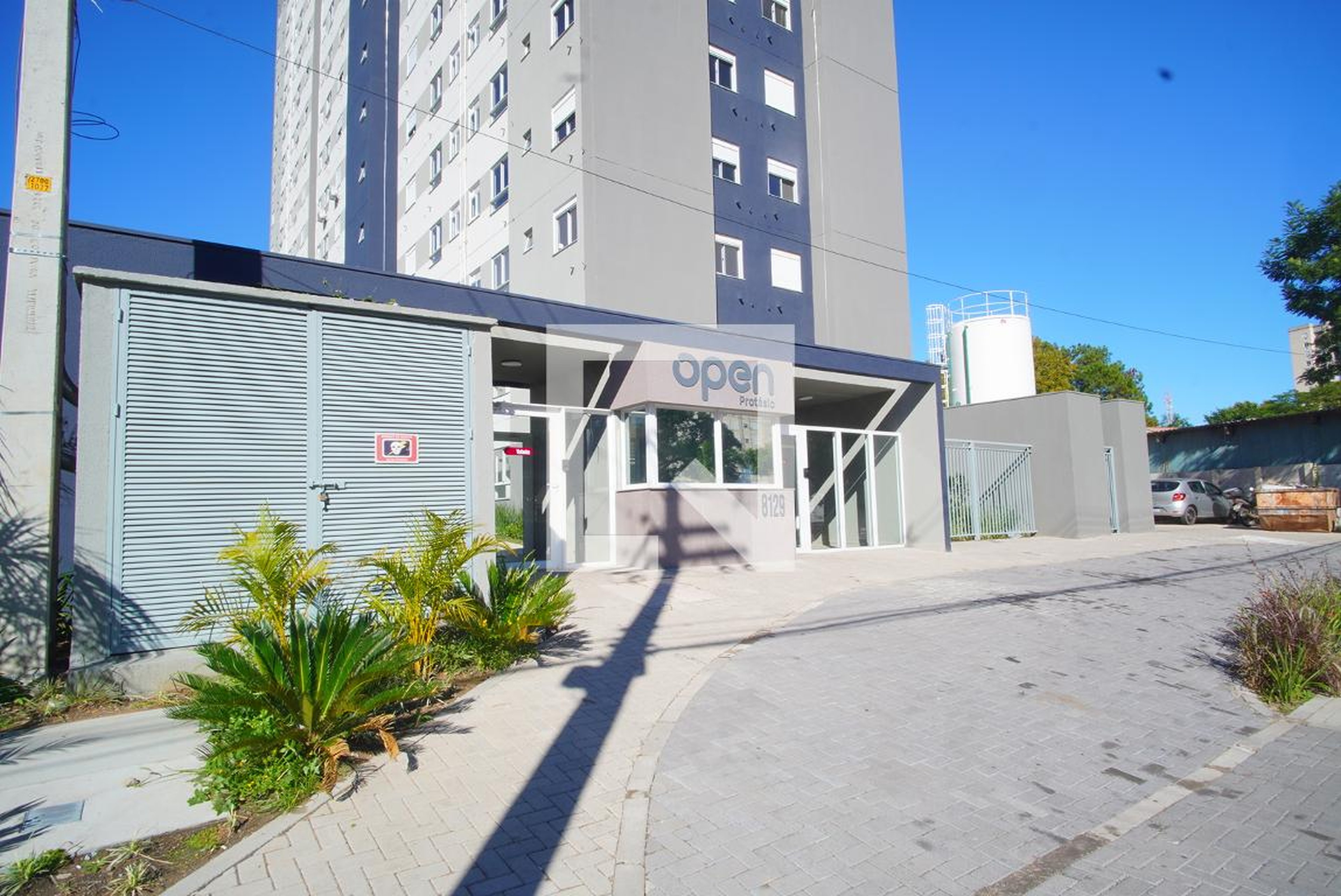 Fachada do Condomínio Condomínio Open Protásio