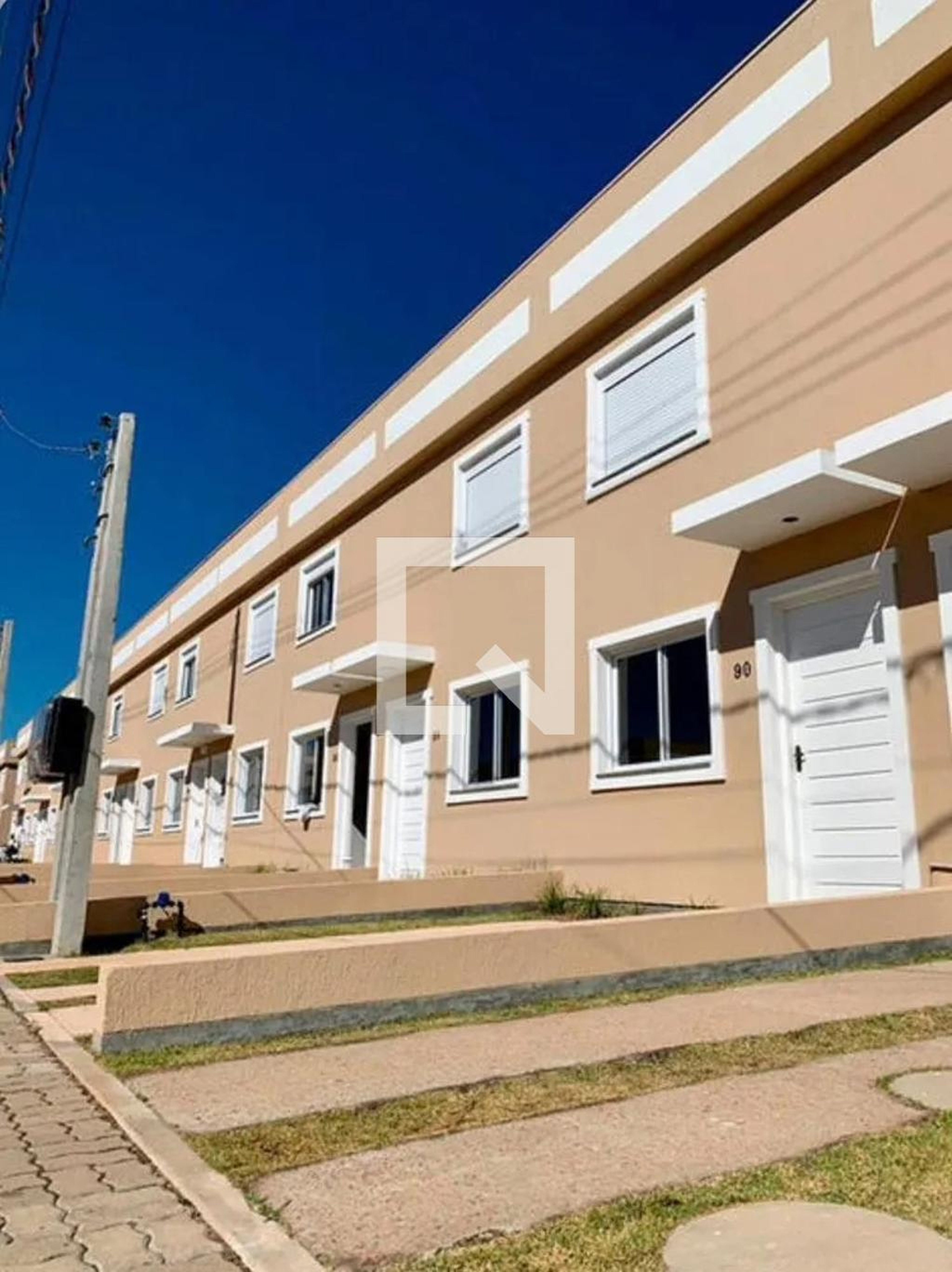 Fachada Condomínio Espatodias
