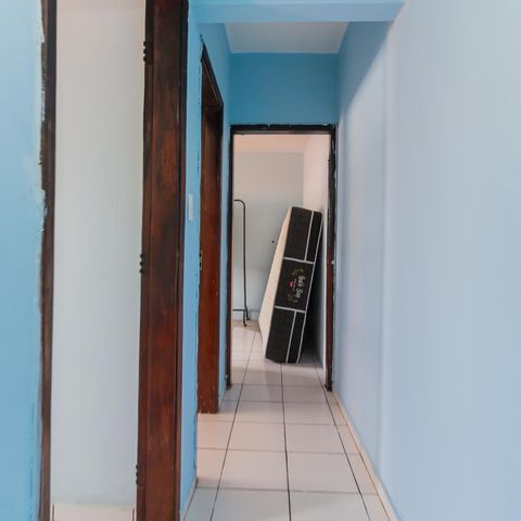 Casa à venda com 150m², 3 quartos e 3 vagasCorredor de acesso aos demais quartos