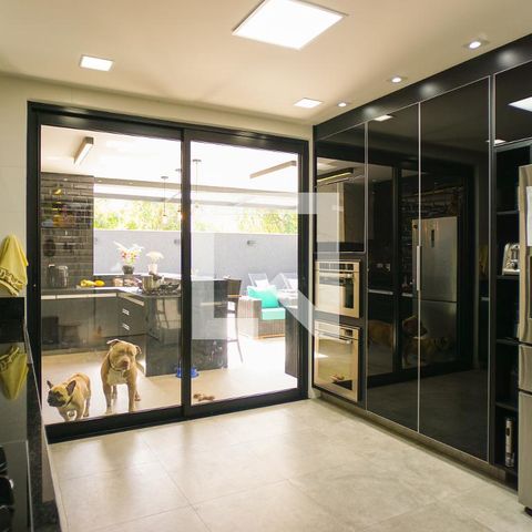 Casa de condomínio à venda com 400m², 4 quartos e 4 vagasCozinha e Área de Serviço