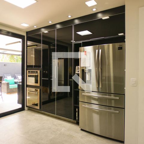 Casa de condomínio à venda com 400m², 4 quartos e 4 vagasCozinha e Área de Serviço