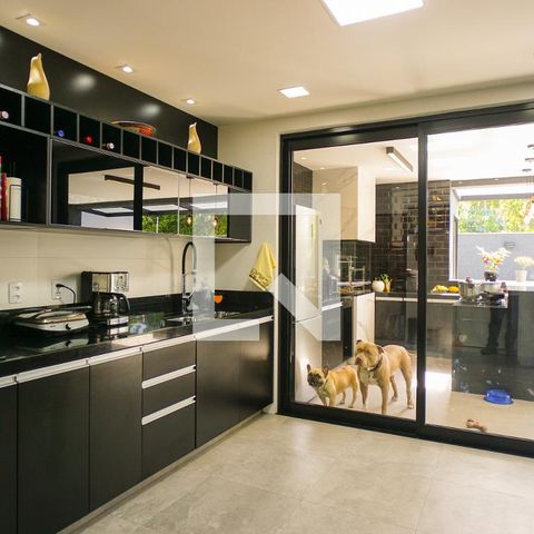 Casa de condomínio à venda com 400m², 4 quartos e 4 vagasCozinha e Área de Serviço