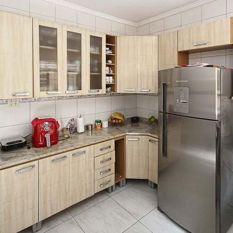Casa à venda com 68m², 3 quartos e 2 vagas Casa à venda com 68m², 3 quartos e 2 vagasCozinha