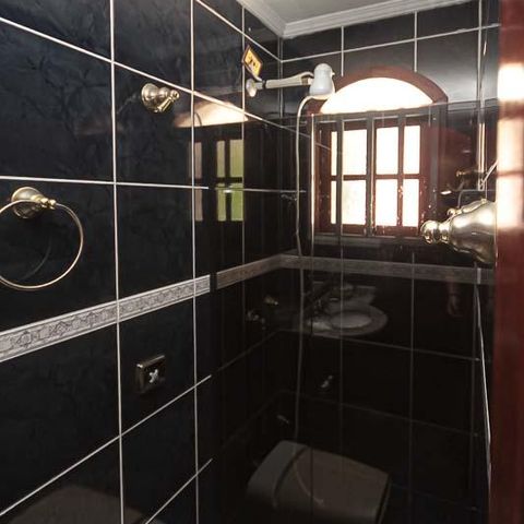Casa à venda com 450m², 3 quartos e 8 vagas Casa à venda com 450m², 3 quartos e 8 vagasBanheiro da Garagem