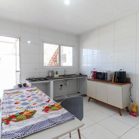 Casa à venda com 125m², 2 quartos e 2 vagas Casa à venda com 125m², 2 quartos e 2 vagasCozinha