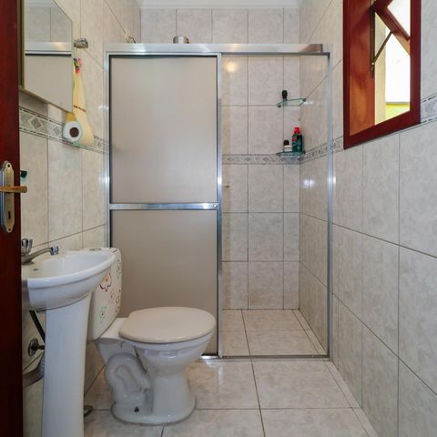 Casa à venda com 143m², 4 quartos e 2 vagas Casa à venda com 143m², 4 quartos e 2 vagasBanheiro da Suíte 2