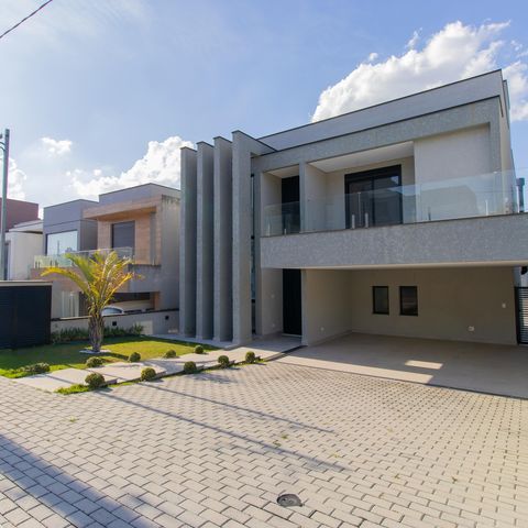 Casa de condomínio para alugar com 380m², 4 quartos e 4 vagasFachada