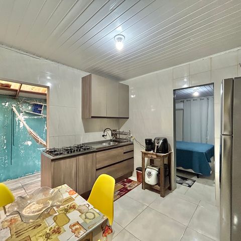 Casa à venda com 60m², 2 quartos e 2 vagas Casa à venda com 60m², 2 quartos e 2 vagasCozinha
