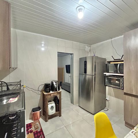 Casa à venda com 60m², 2 quartos e 2 vagas Casa à venda com 60m², 2 quartos e 2 vagasCozinha