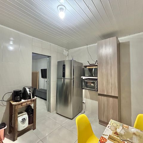 Casa à venda com 60m², 2 quartos e 2 vagas Casa à venda com 60m², 2 quartos e 2 vagasCozinha