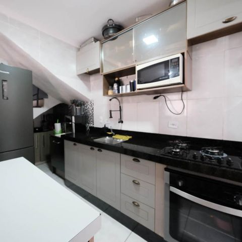 Casa de condomínio à venda com 71m², 2 quartos e 2 vagasSala/Cozinha