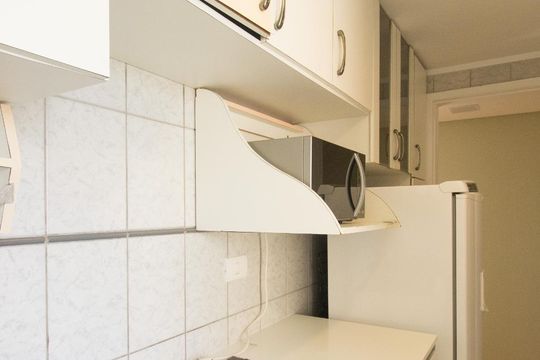 Cozinha de apartamento à venda com 3 quartos, 60m² em Campo Comprido, Curitiba
