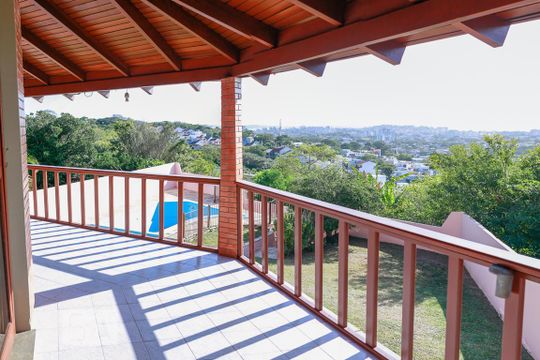 Varanda da Sala de casa à venda com 6 quartos, 450m² em Vila Nova, Porto Alegre