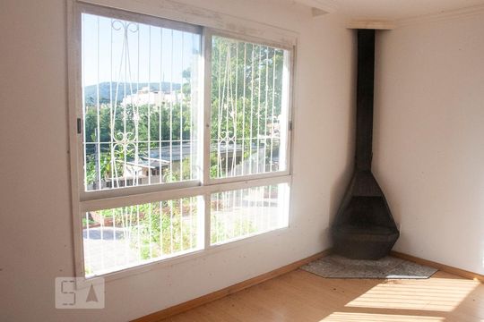 Sala de casa de condomínio à venda com 3 quartos, 250m² em Santo Antônio, Porto Alegre