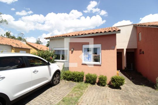 Fachada de casa de condomínio à venda com 2 quartos, 100m² em Olaria, Canoas