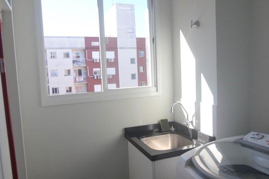 Área de serviço de apartamento à venda com 2 quartos, 57m² em Fátima, Canoas