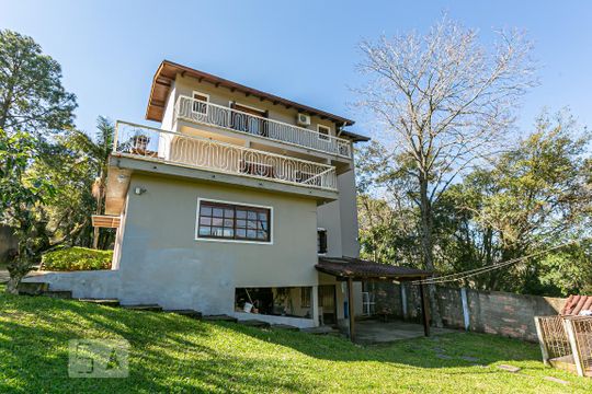 Fachada de casa à venda com 5 quartos, 320m² em Vila Nova, Porto Alegre
