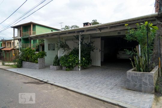 Fachada de casa à venda com 3 quartos, 340m² em Vila Nova, Porto Alegre