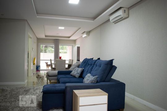 Sala de Estar de casa de condomínio à venda com 4 quartos, 213m² em Vila Nova, Porto Alegre